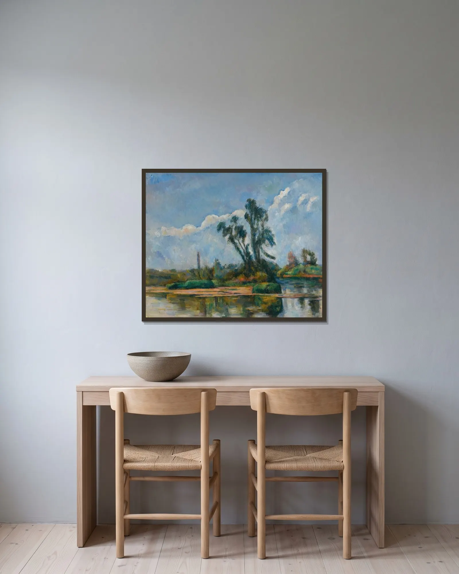 La Rivière av Paul Cézanne inramad på en vägg