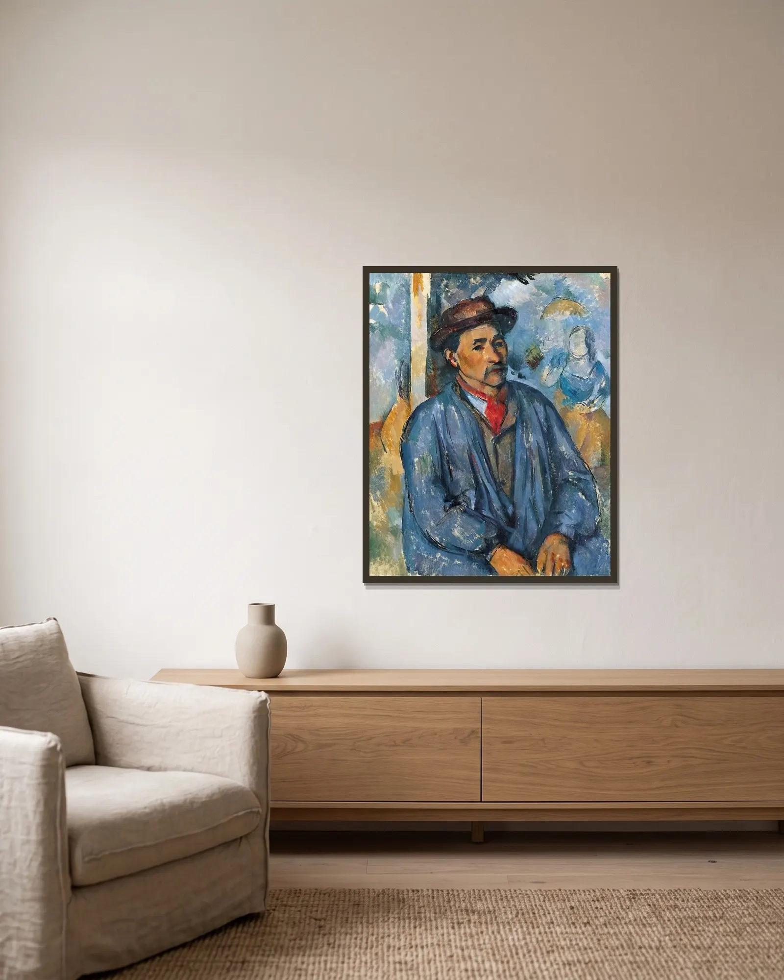 Man in a Blue Smock av Paul Cézanne inramad på en vägg