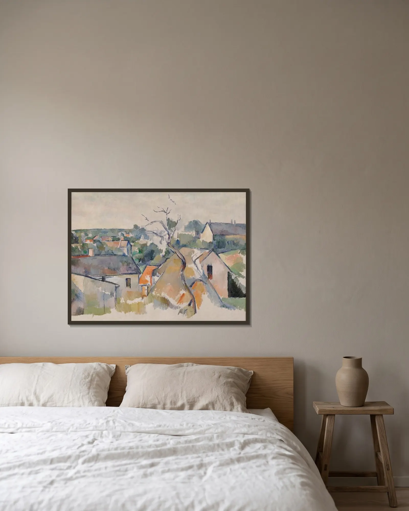 The Rooftops av Paul Cézanne inramad på en vägg