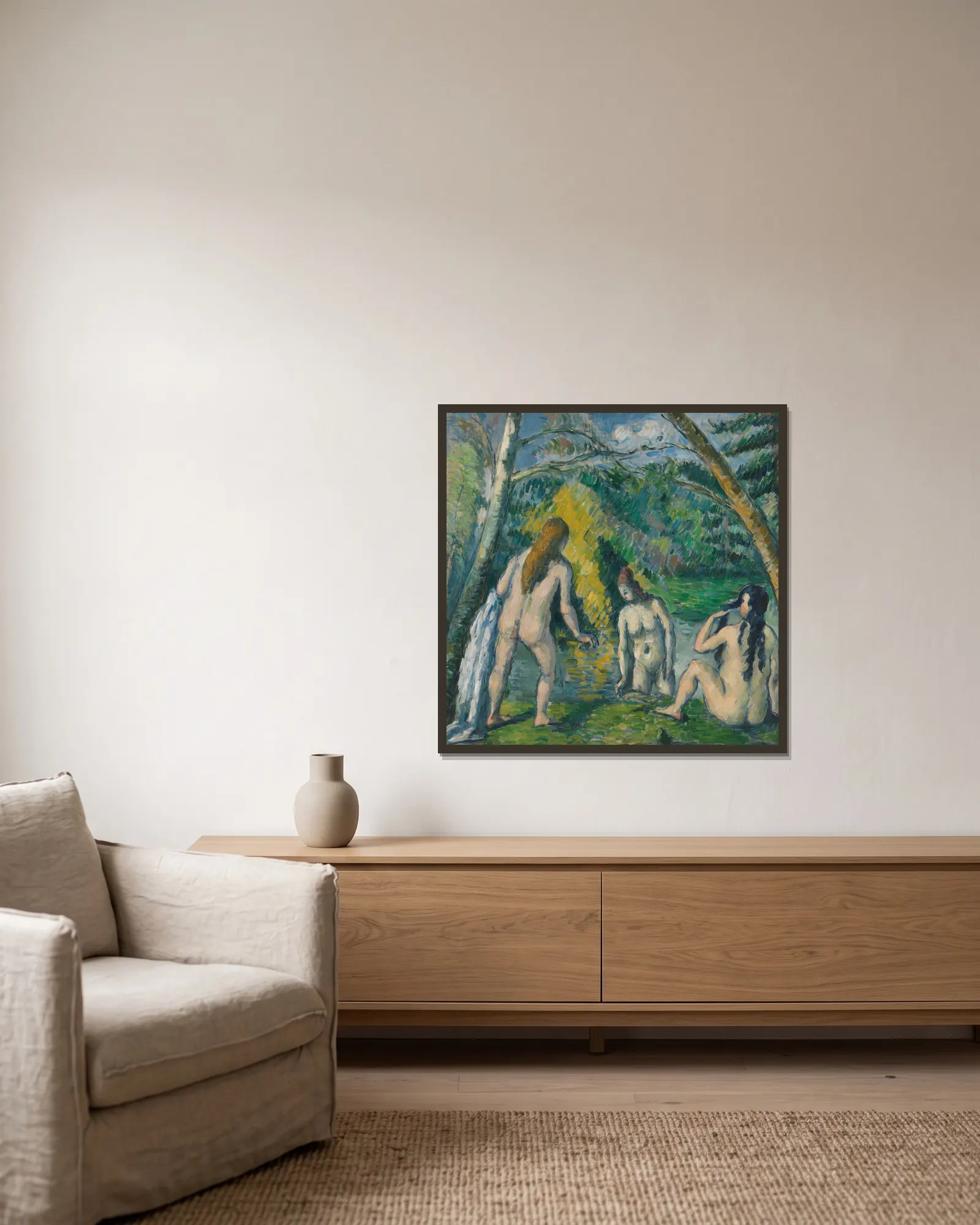 Trois baigneuses av Paul Cézanne inramad på en vägg