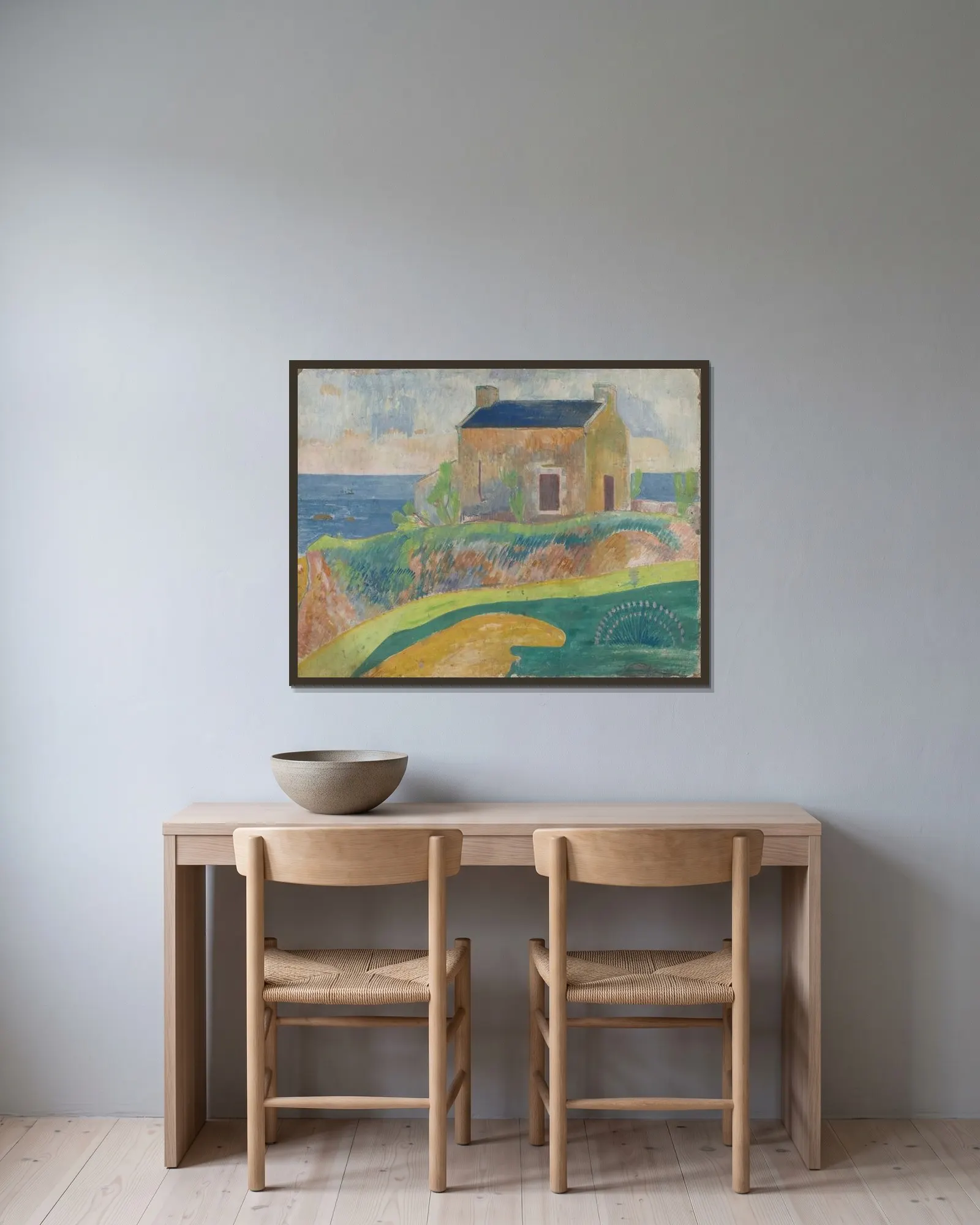 La Maison Du Pendu av Paul Gauguin inramad på en vägg