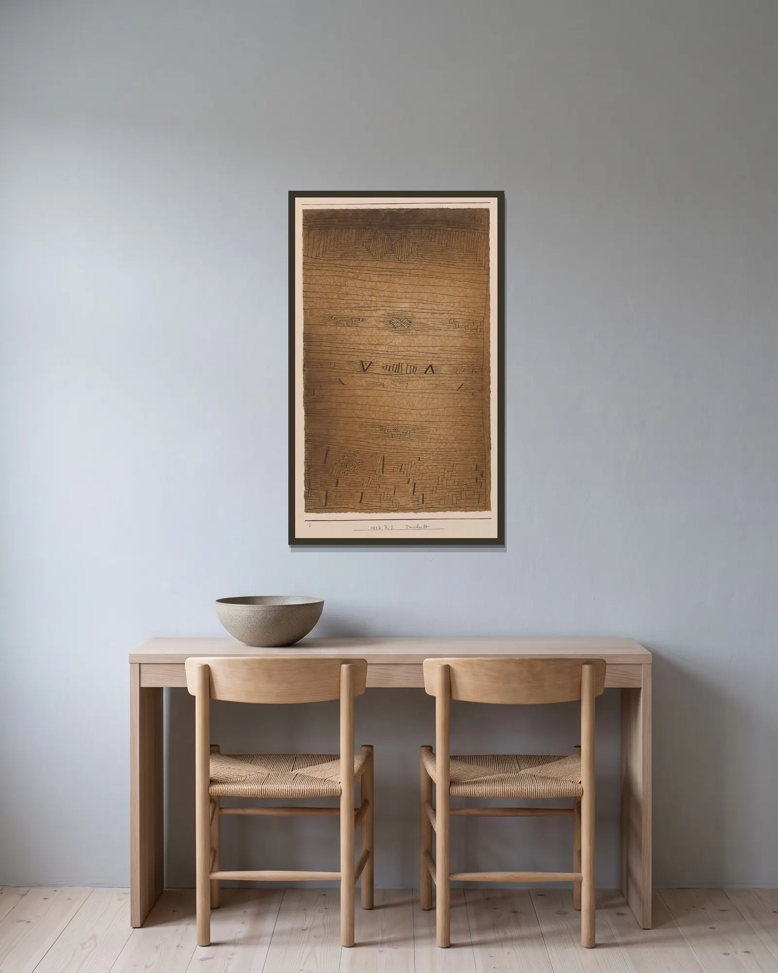 Inscription av Paul Klee inramad på en vägg