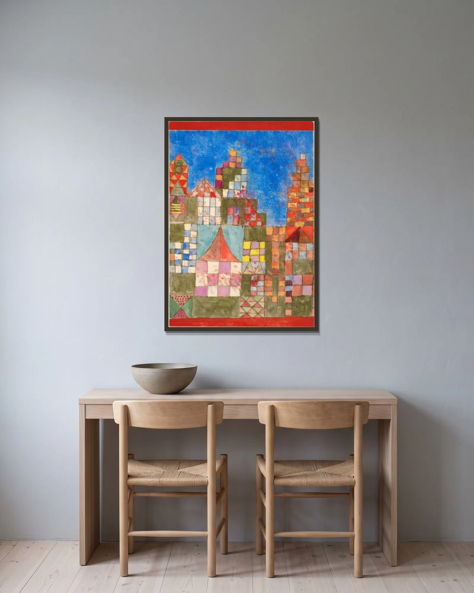 Westöstliche Bauten av Paul Klee inramad på en vägg