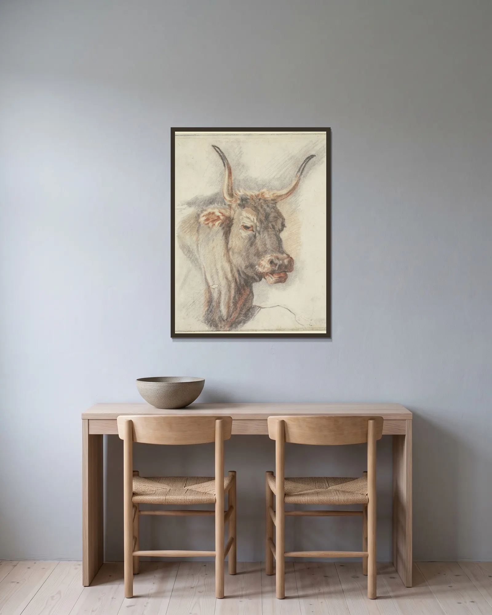 An ox head av Paulus Potter inramad på en vägg