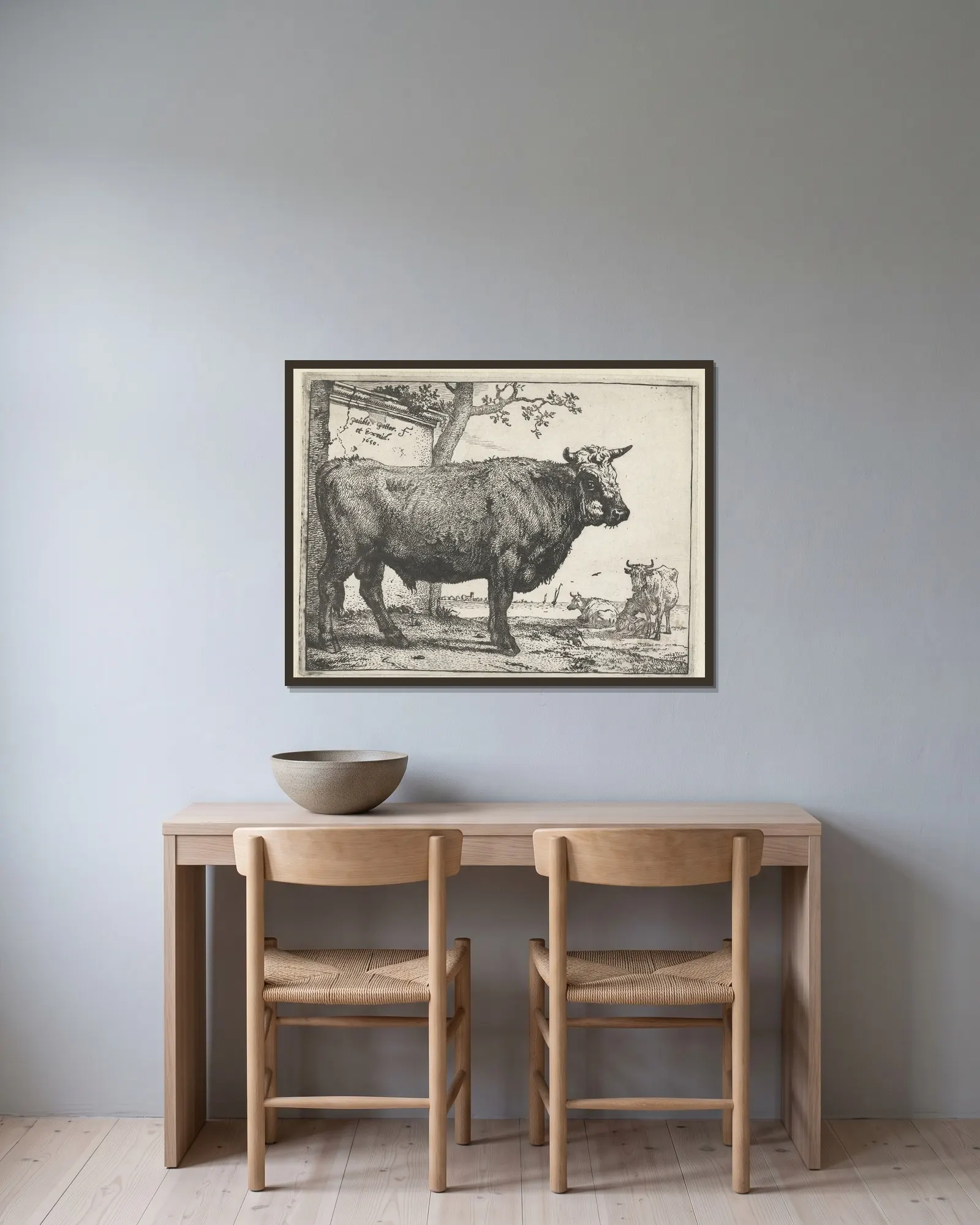 Bull av Paulus Potter inramad på en vägg