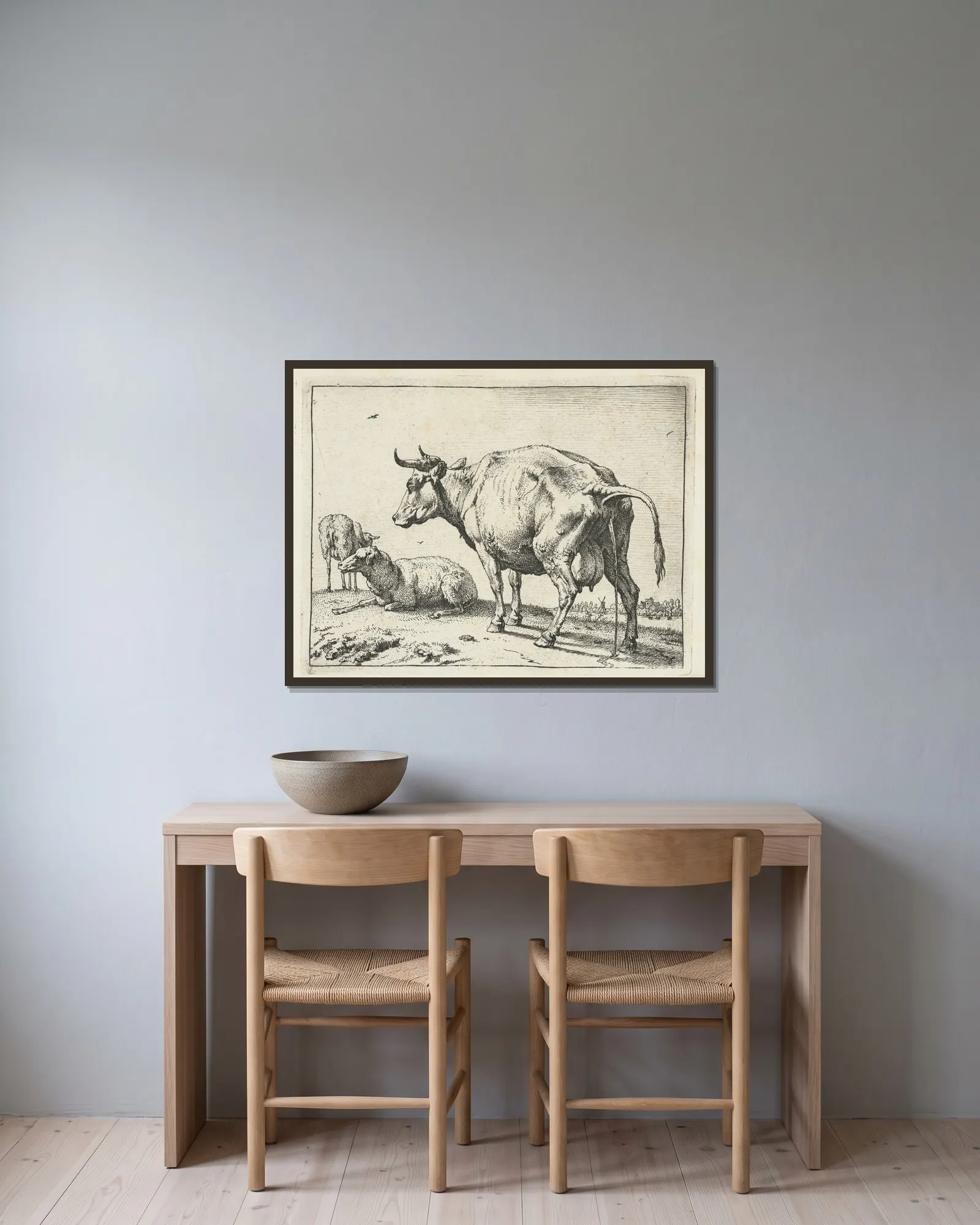 Cow peeing av Paulus Potter inramad på en vägg
