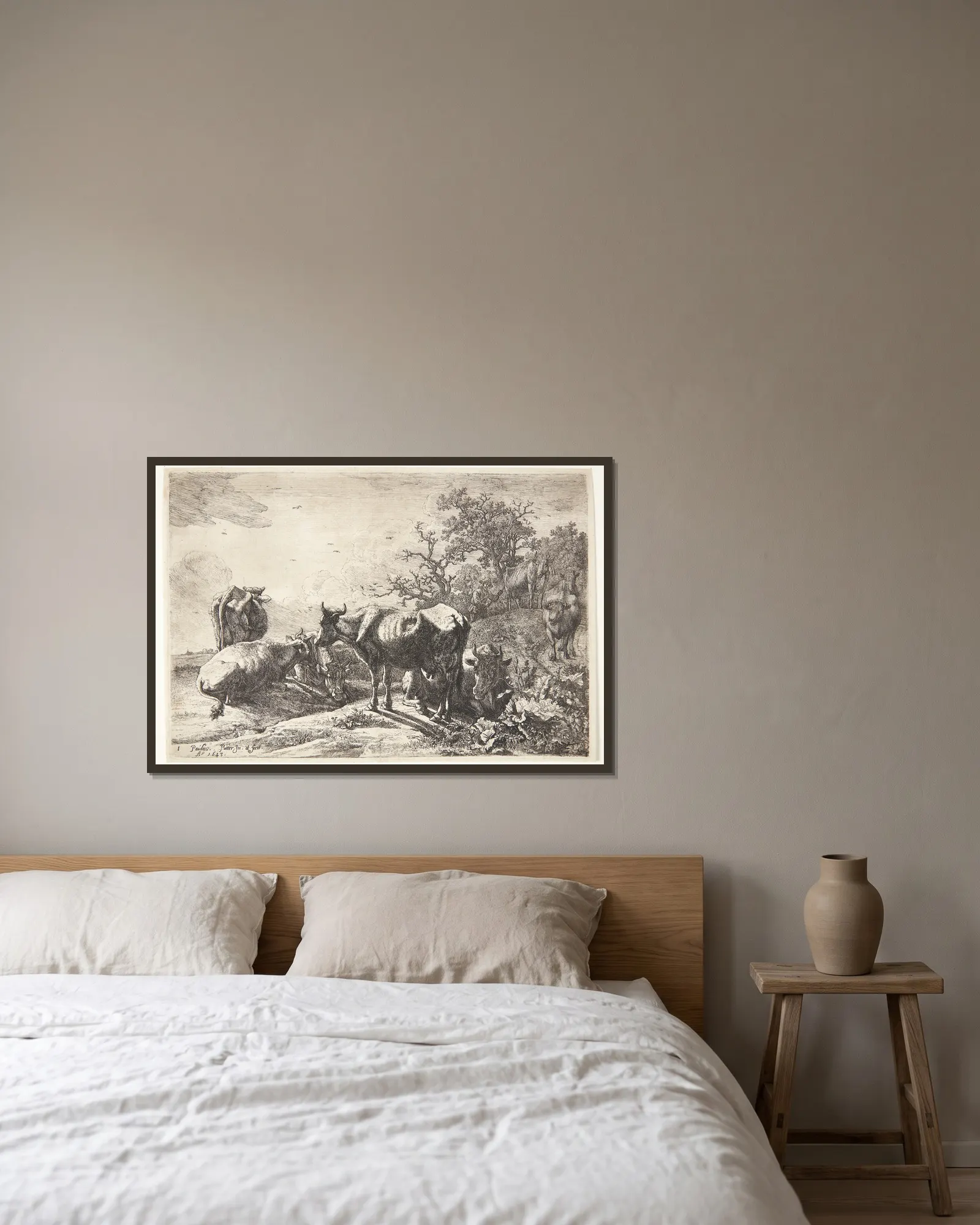 Kohyrden av Paulus Potter inramad på en vägg