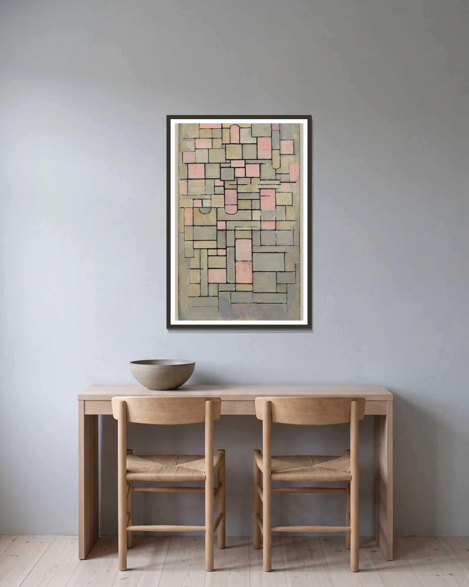 Composition 8 av Piet Mondrian inramad på en vägg