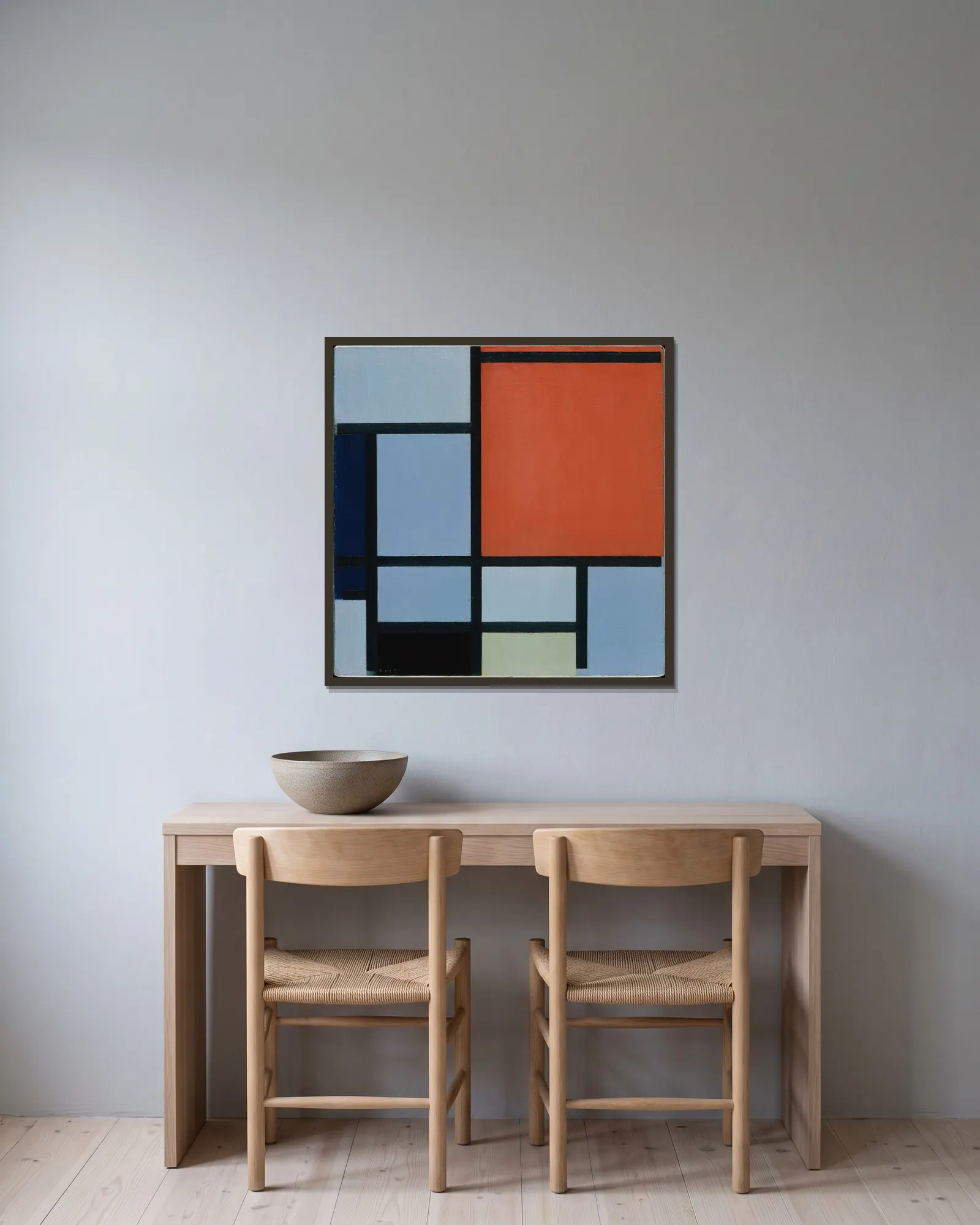 Composition av Piet Mondrian inramad på en vägg