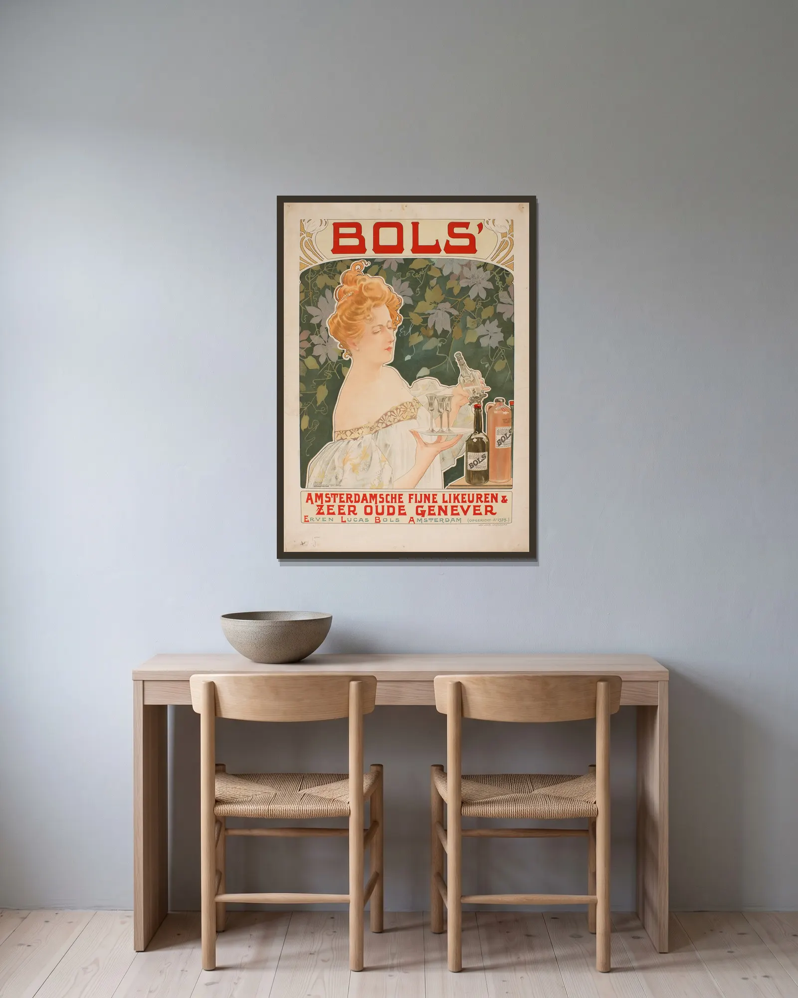 Bols av Henri Privat-Livemont inramad på en vägg
