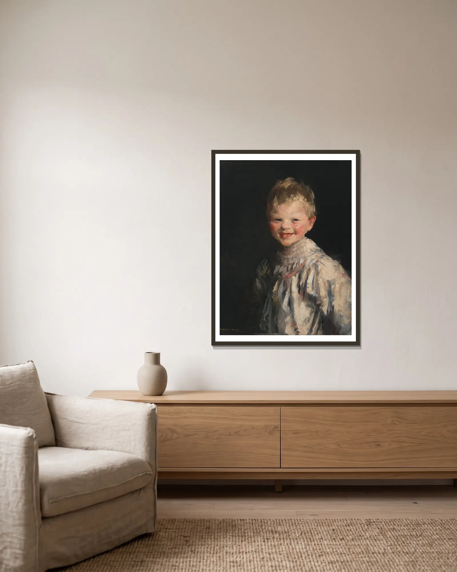 Laughing Child av Robert Henri inramad på en vägg