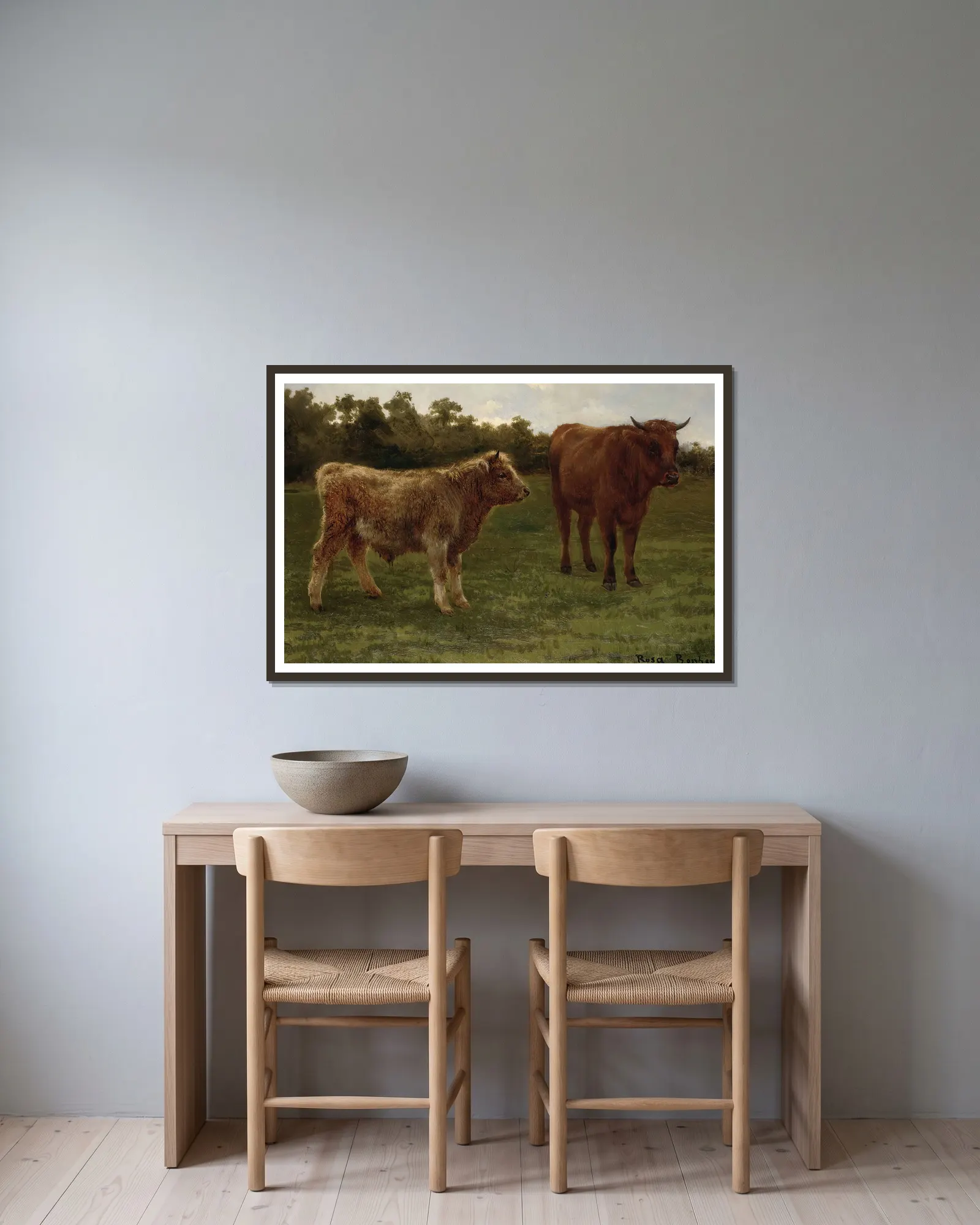 Two Cows Grazing av Rosa Bonheur inramad på en vägg