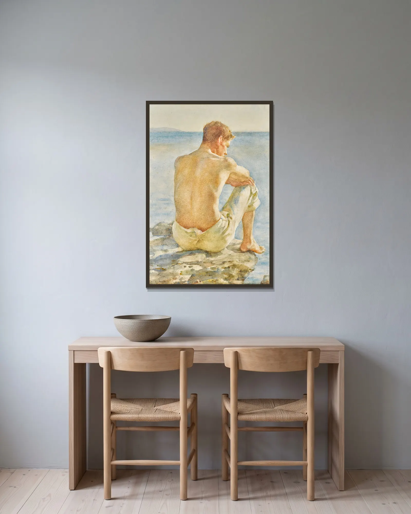Watching the sea av Henry Scott Tuke inramad på en vägg