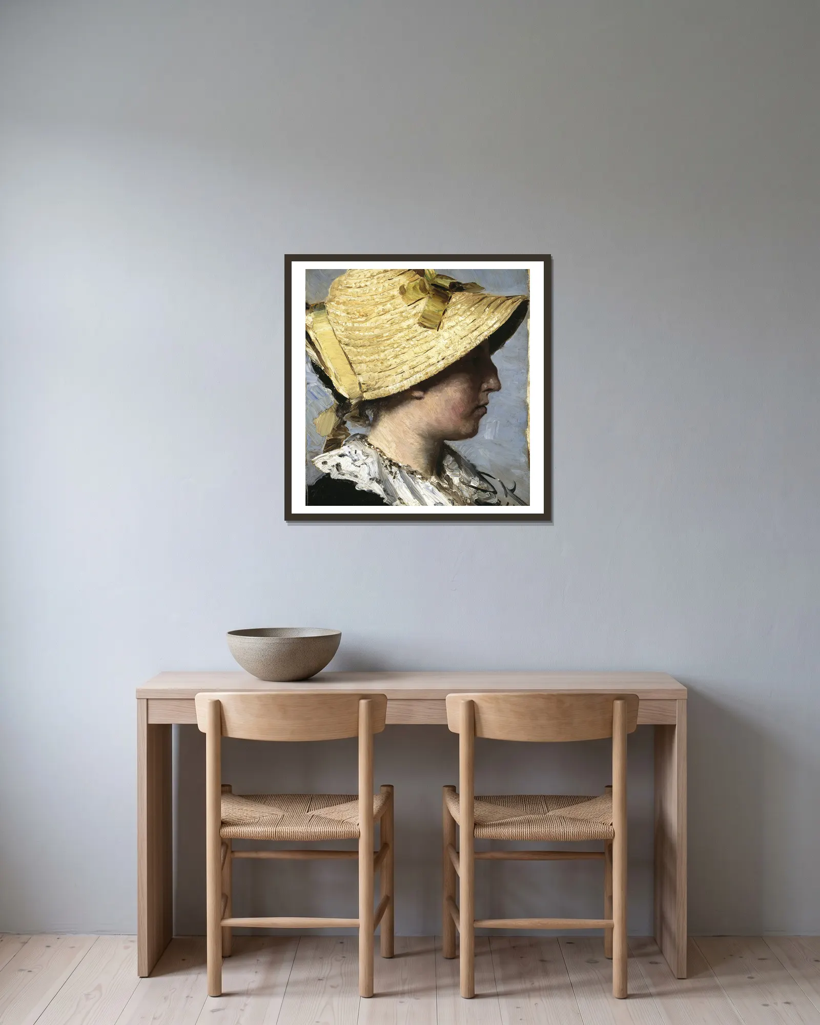 Anna Ancher av Peder Severin Krøyer inramad på en vägg