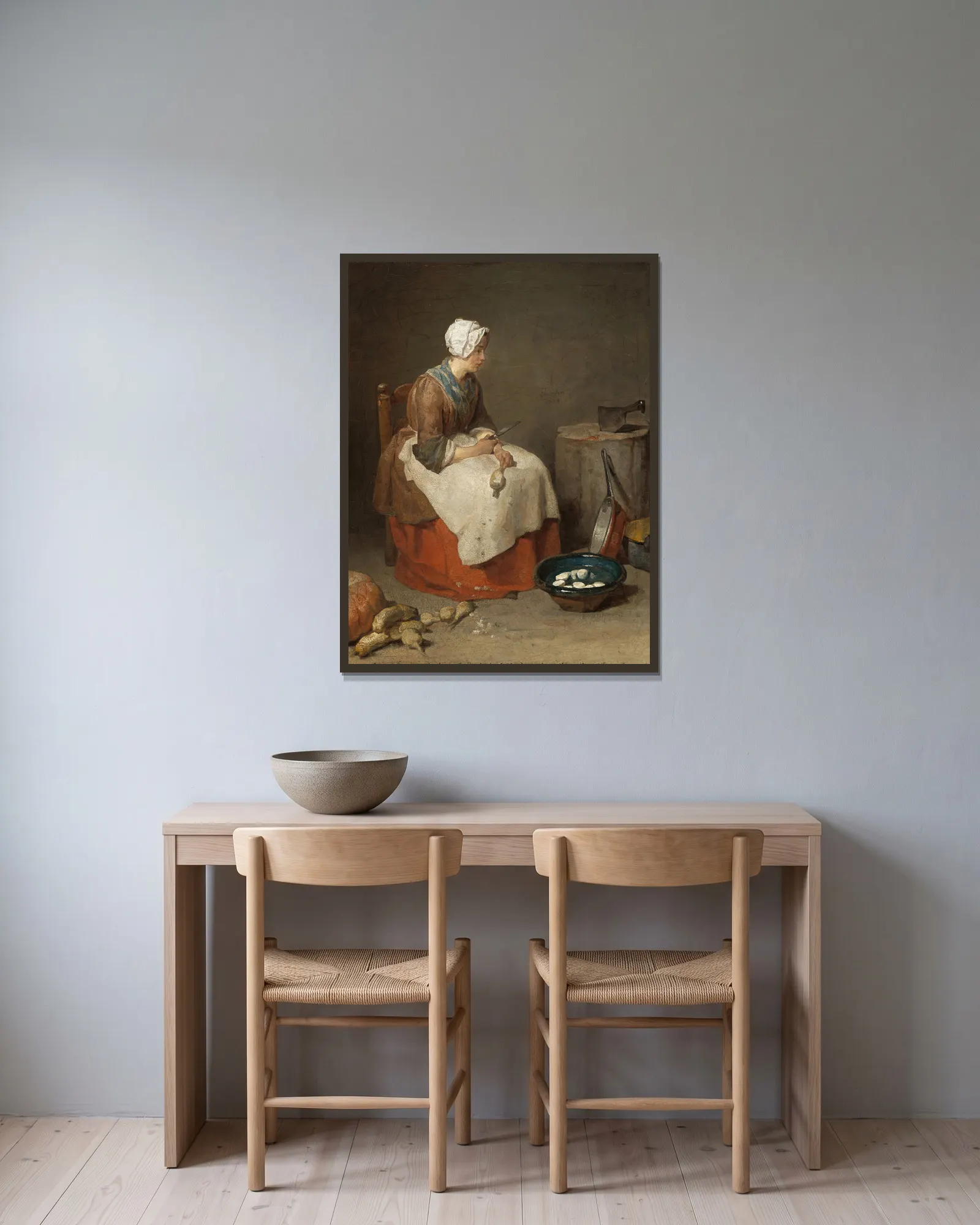 The Kitchen Maid av Jean Siméon Chardin inramad på en vägg