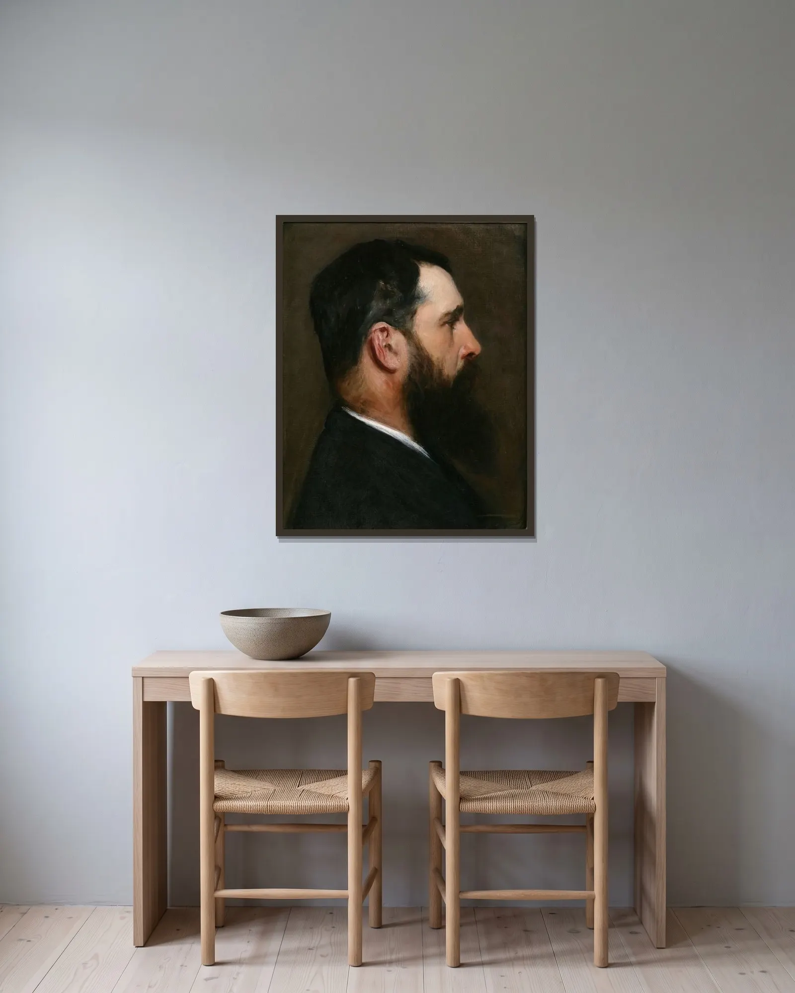 Claude Monet av John Singer Sargent inramad på en vägg