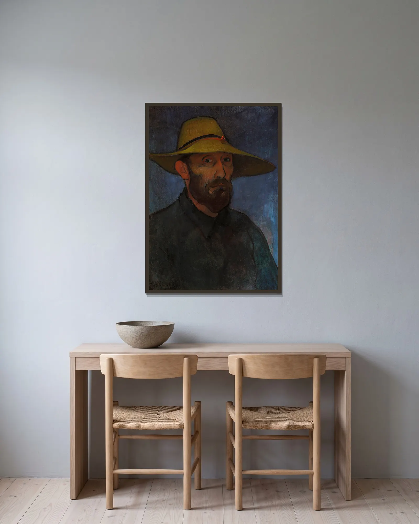 Self-portrait in a straw hat av Władysław Ślewiński inramad på en vägg