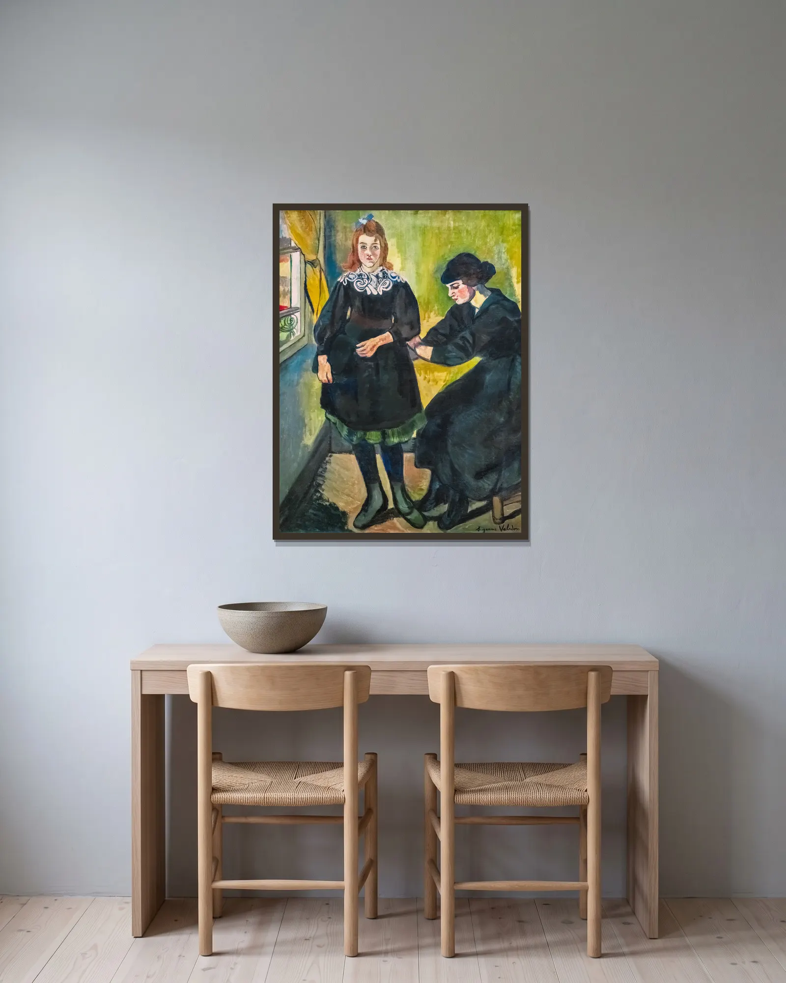 La couturière av Suzanne Valadon inramad på en vägg