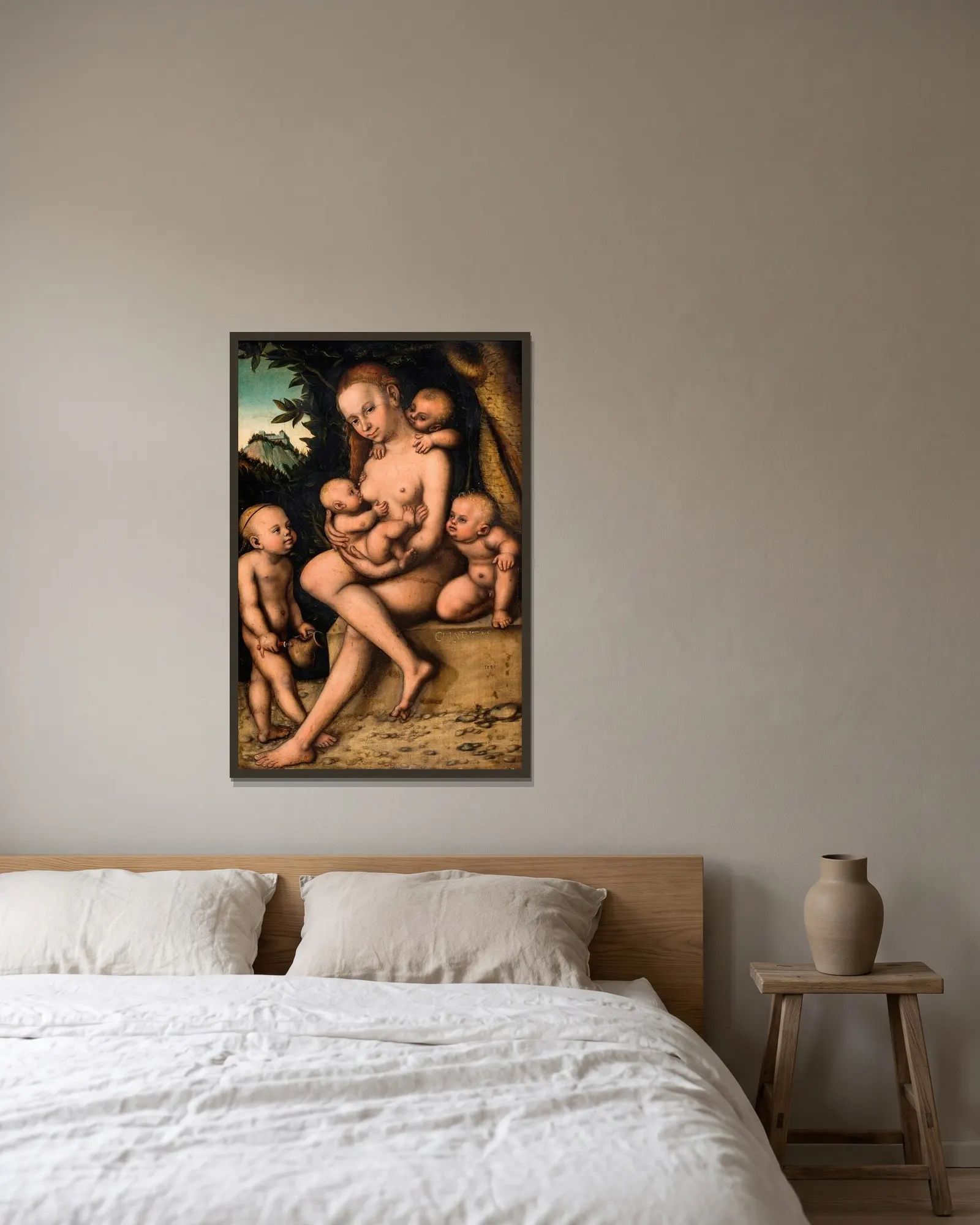 Caritas av Lucas Cranach the Elder inramad på en vägg