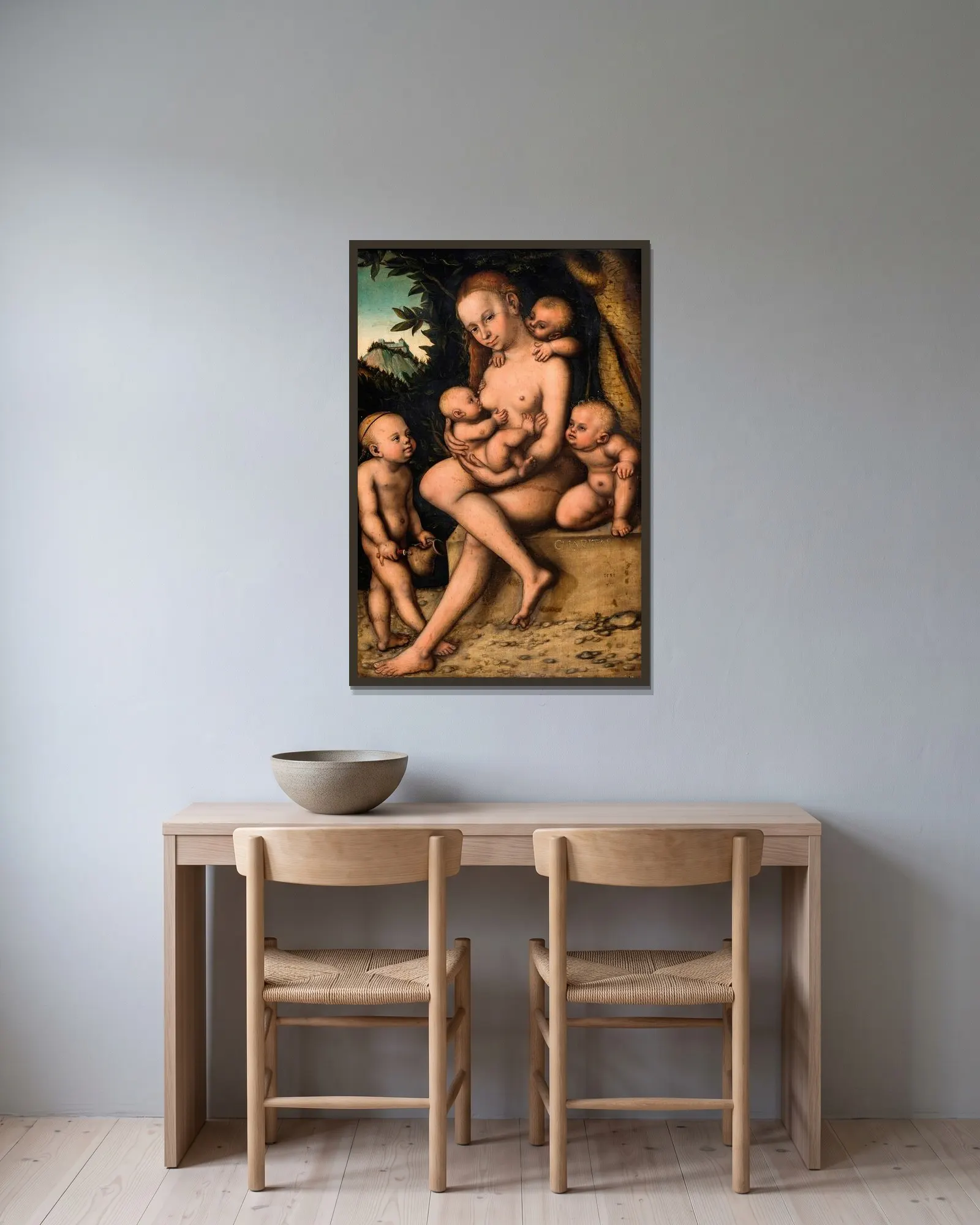 Caritas av Lucas Cranach the Elder inramad på en vägg
