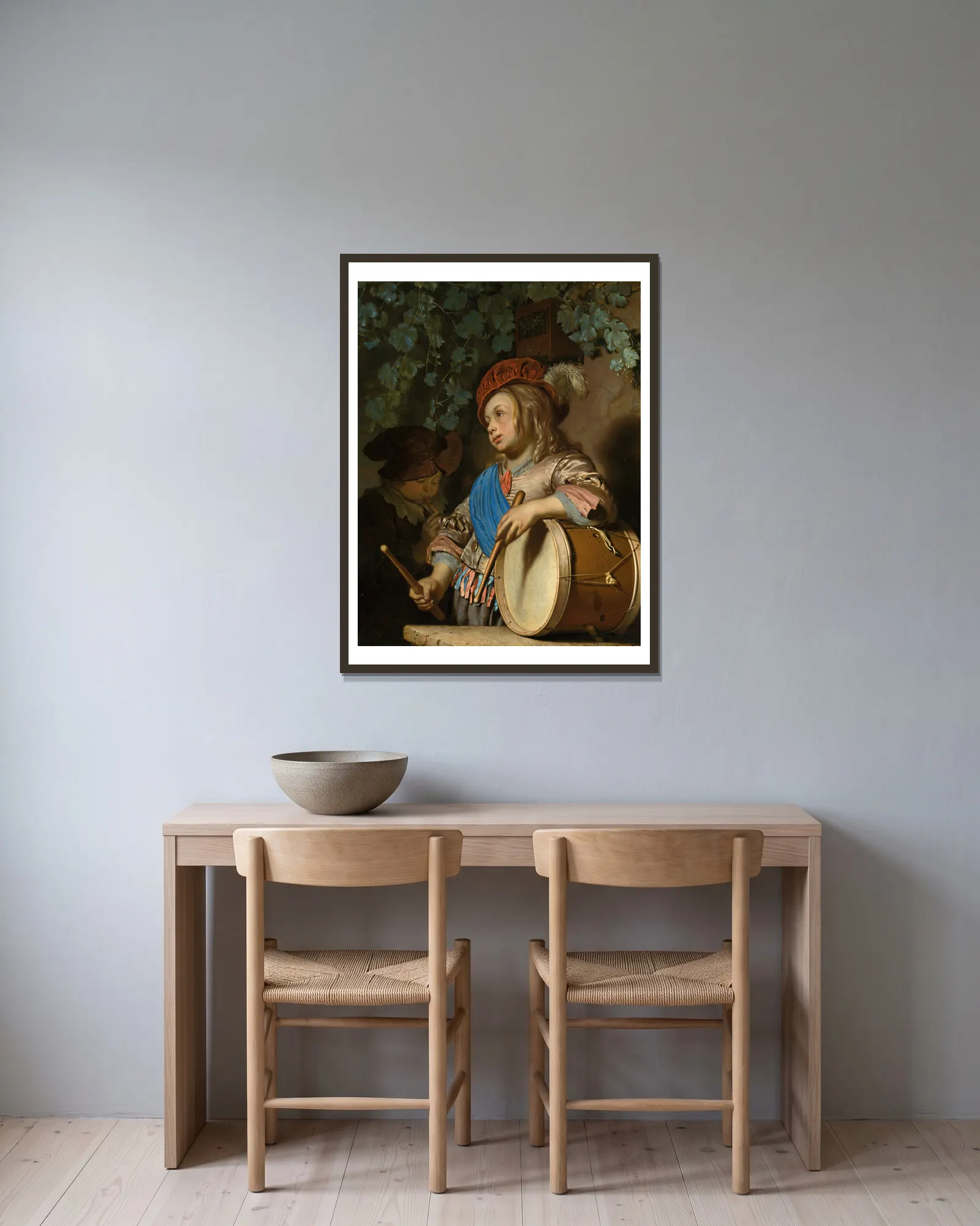 The Drummer Boy av Frans van Mieris the Elder inramad på en vägg