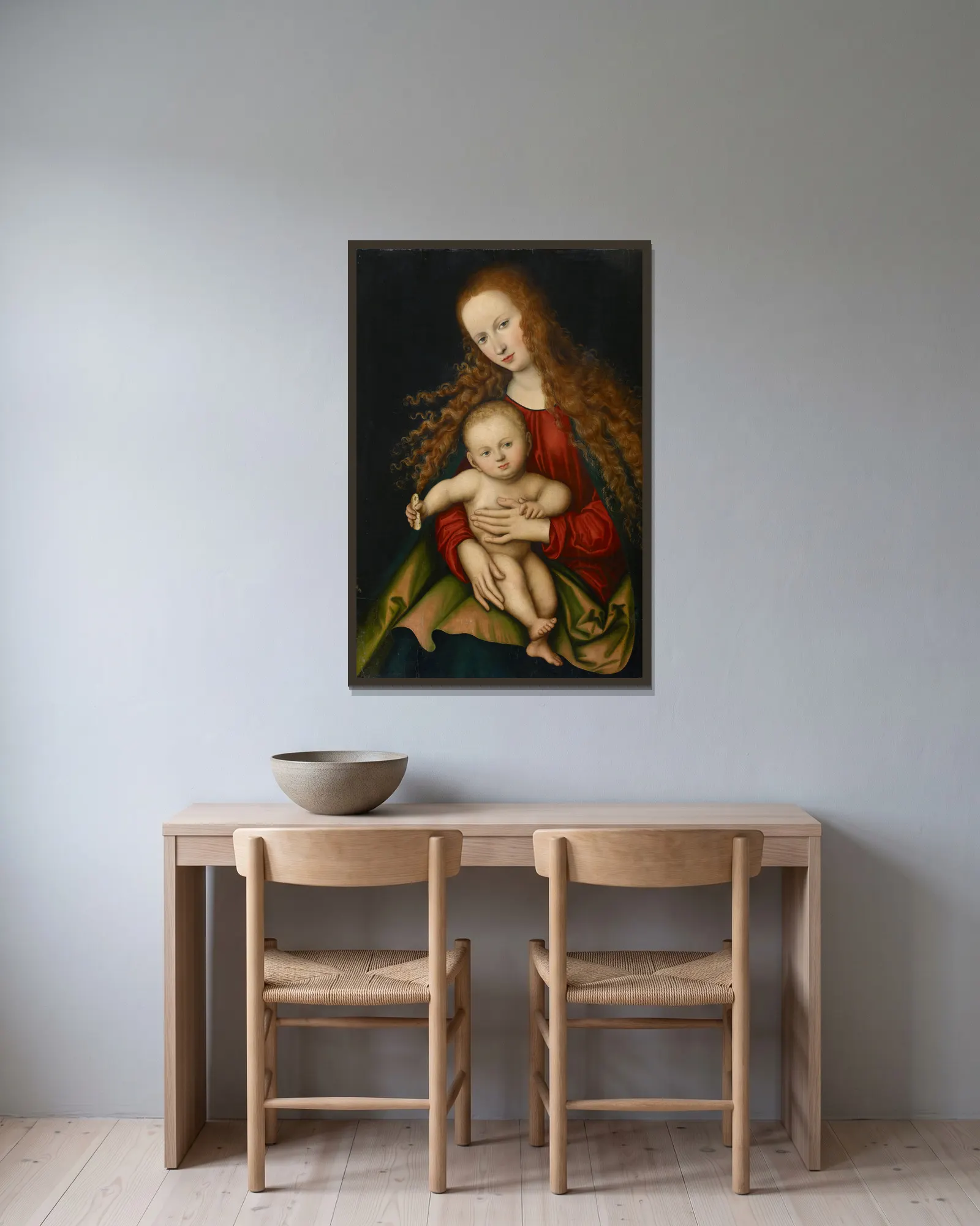 Virgin and Child av Lucas Cranach the Elder inramad på en vägg