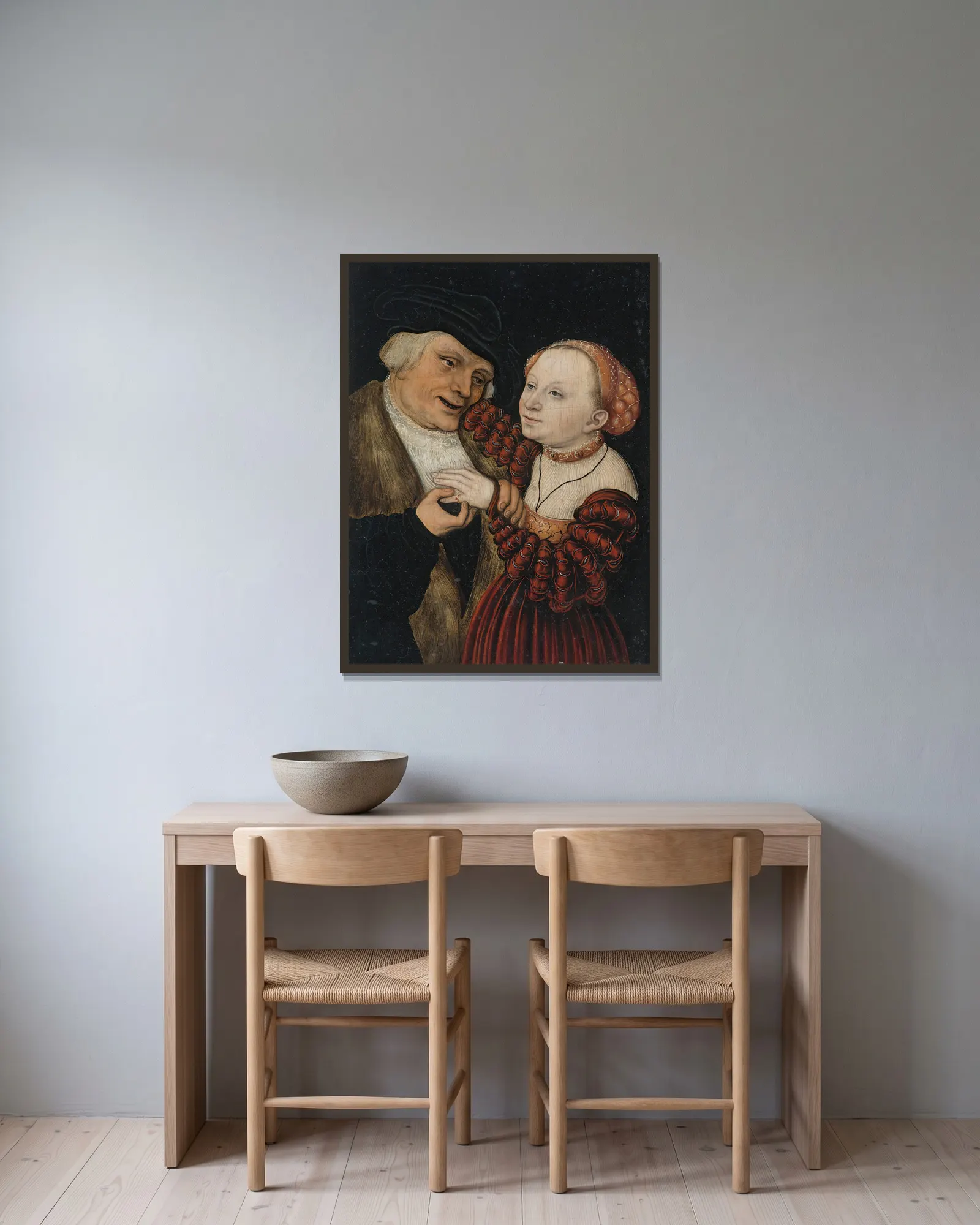 The Ill-Matched Lovers av Lucas Cranach the Younger inramad på en vägg