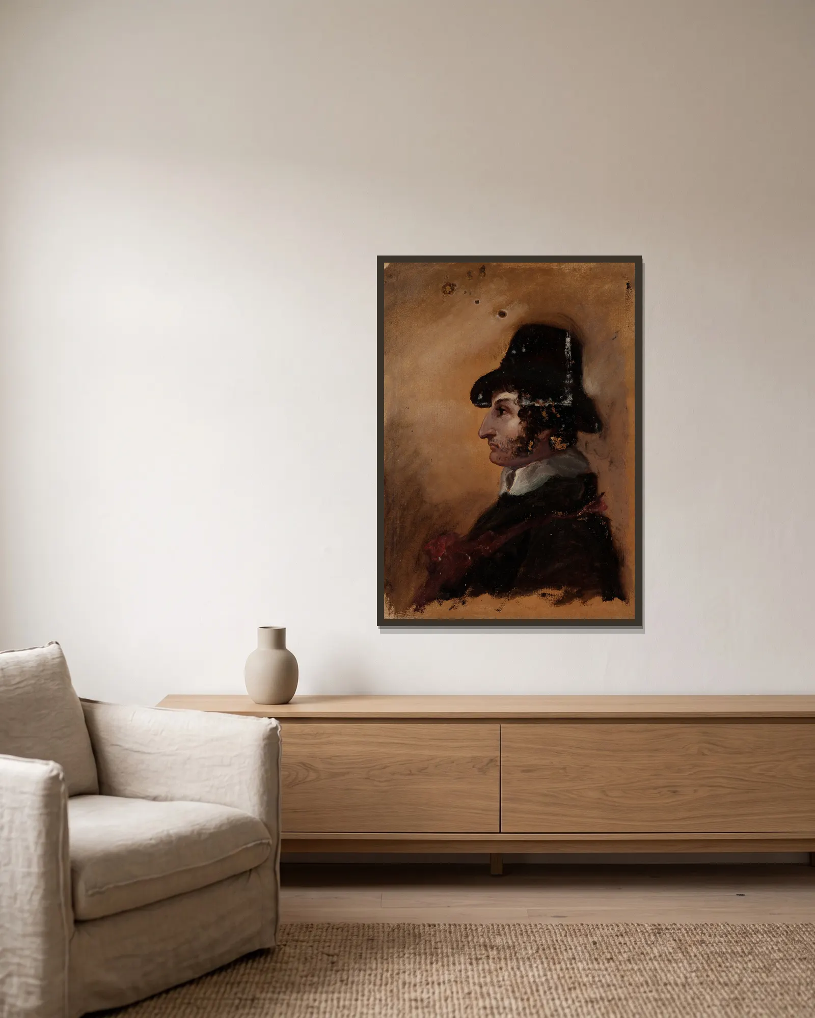 Man in a High Hat av Thomas Cole inramad på en vägg