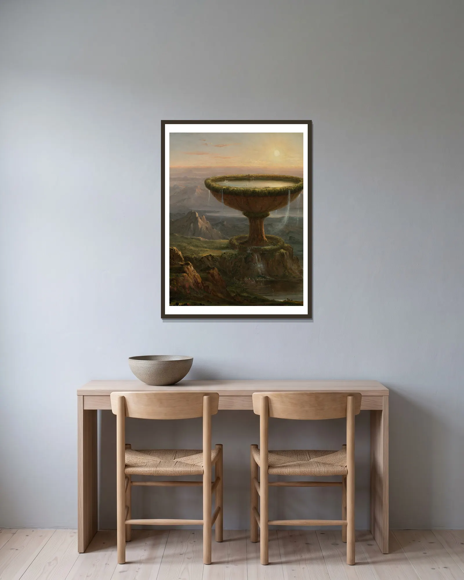 The Titan’s Goblet av Thomas Cole inramad på en vägg