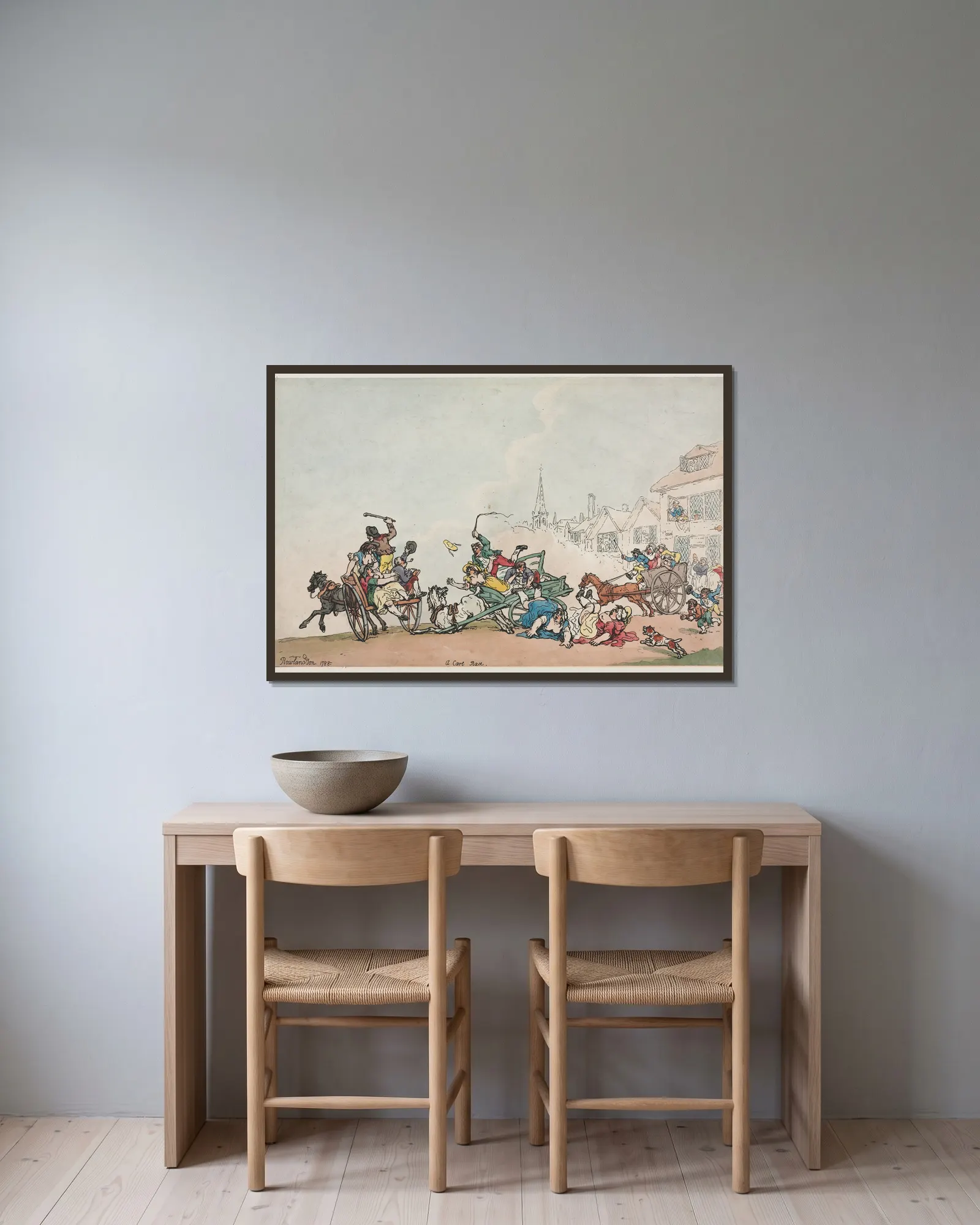 A Cart Race av Thomas Rowlandson inramad på en vägg