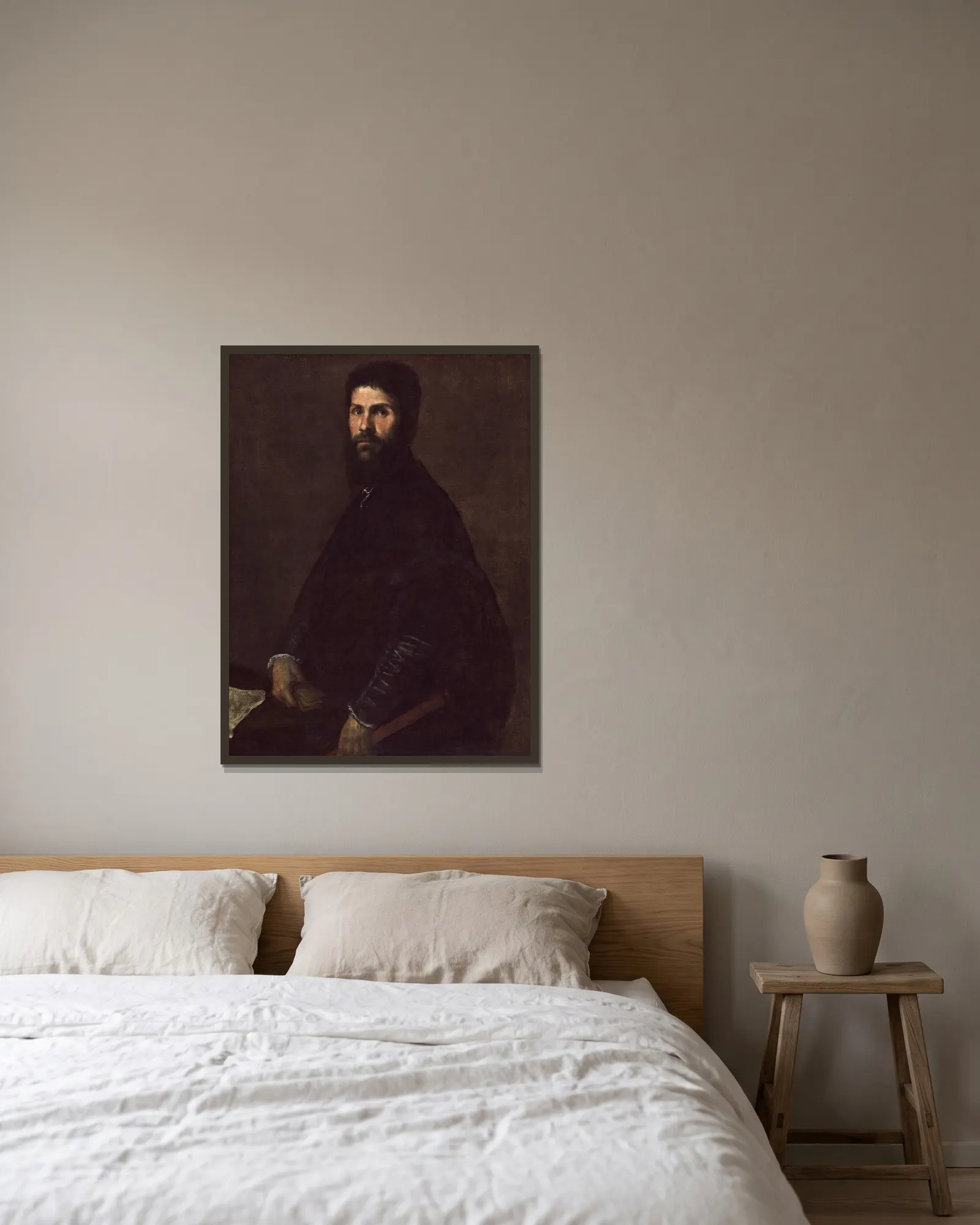 Man Holding a Flute av Titian inramad på en vägg