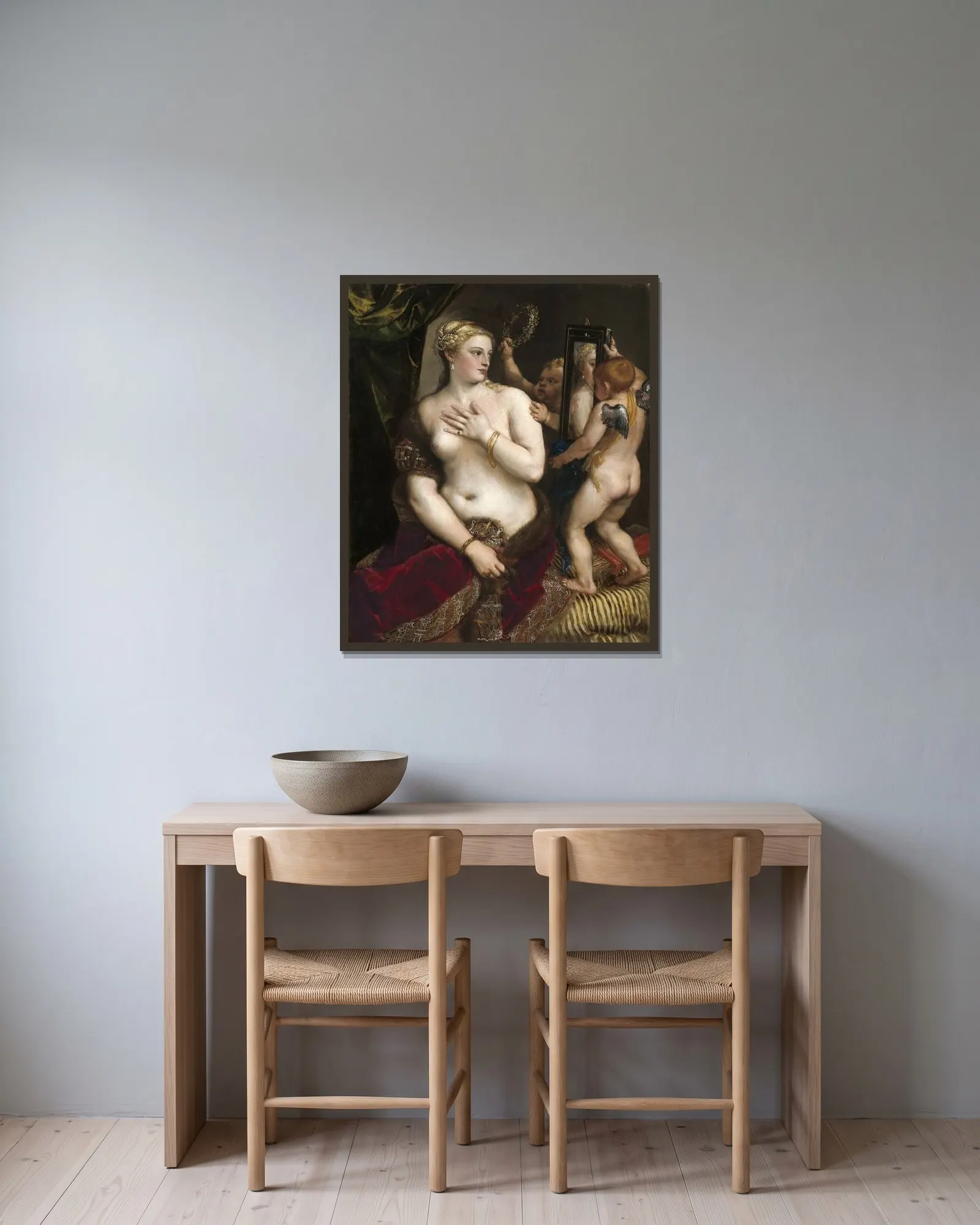 Venus With a Mirror av Titian inramad på en vägg
