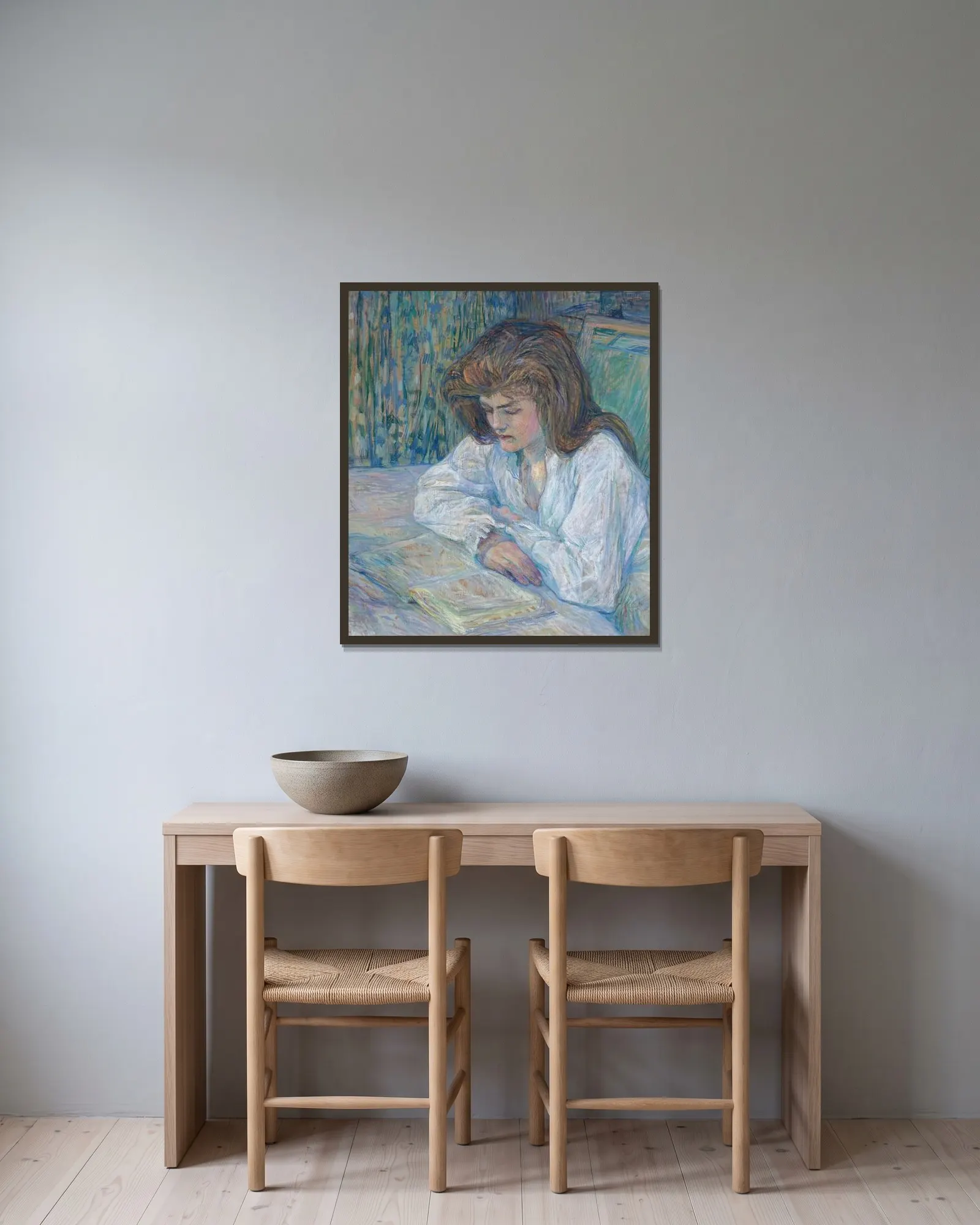 La Liseuse av Henri de Toulouse-Lautrec inramad på en vägg
