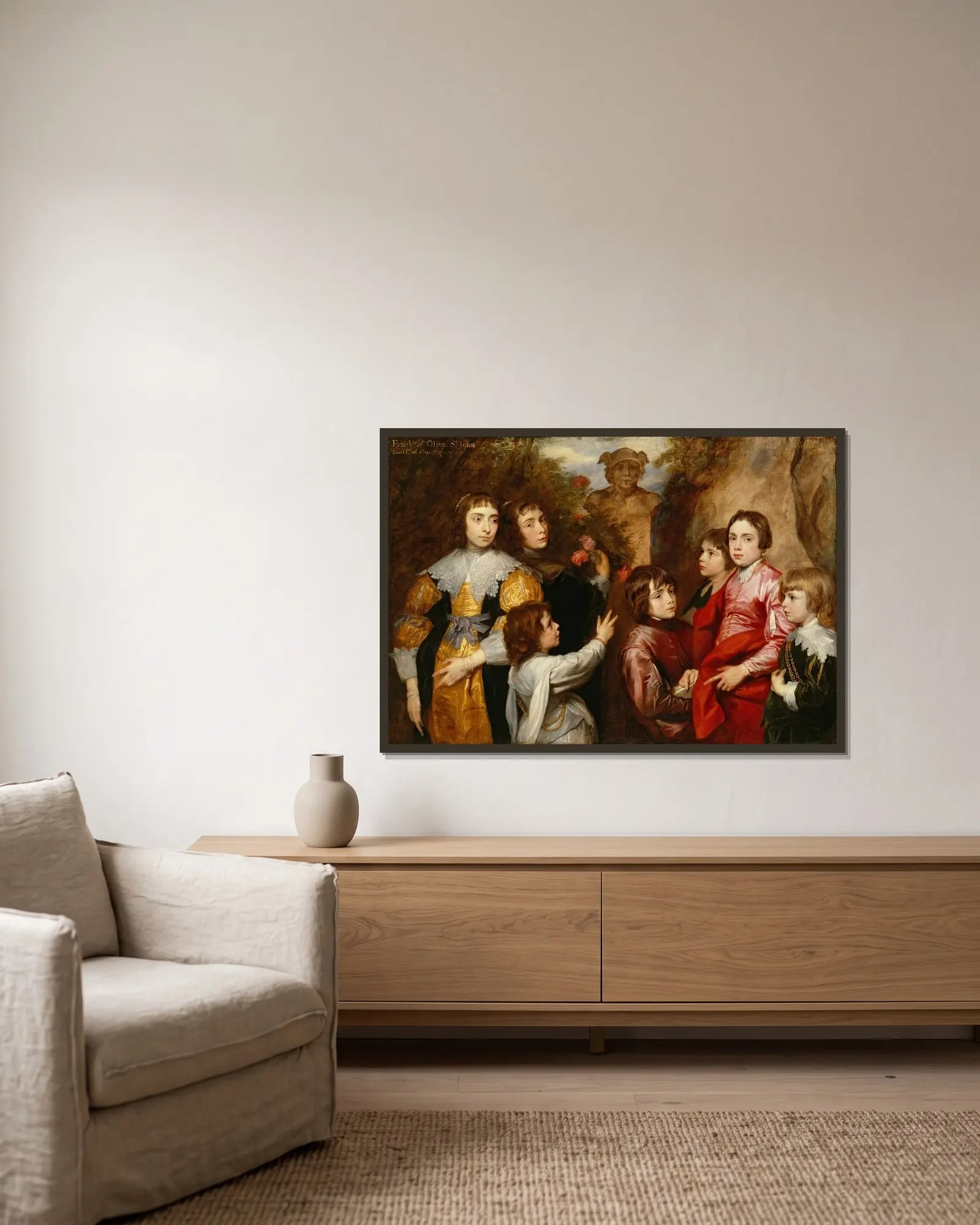 A Family Group av Anthony van Dyck inramad på en vägg