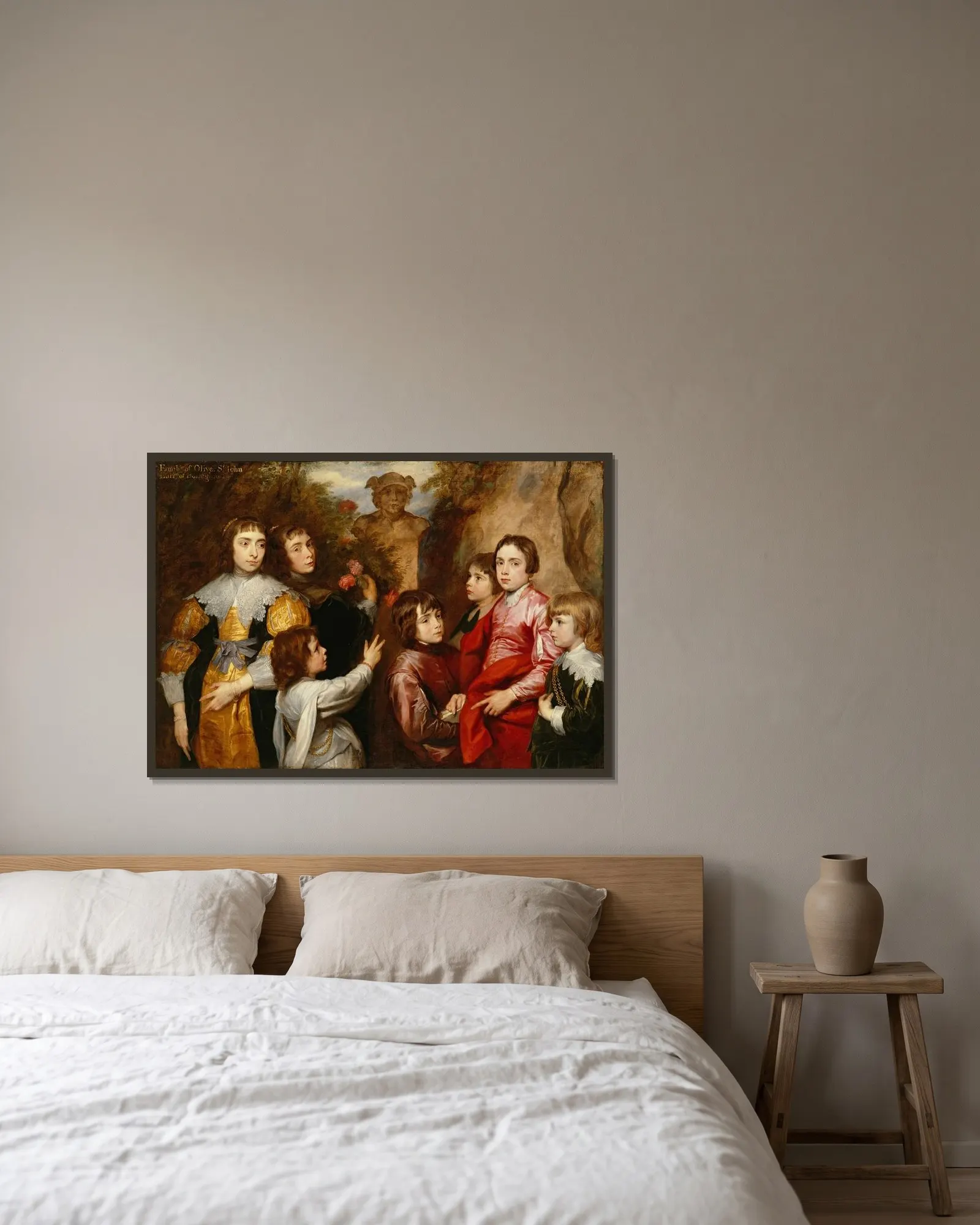 A Family Group av Anthony van Dyck inramad på en vägg
