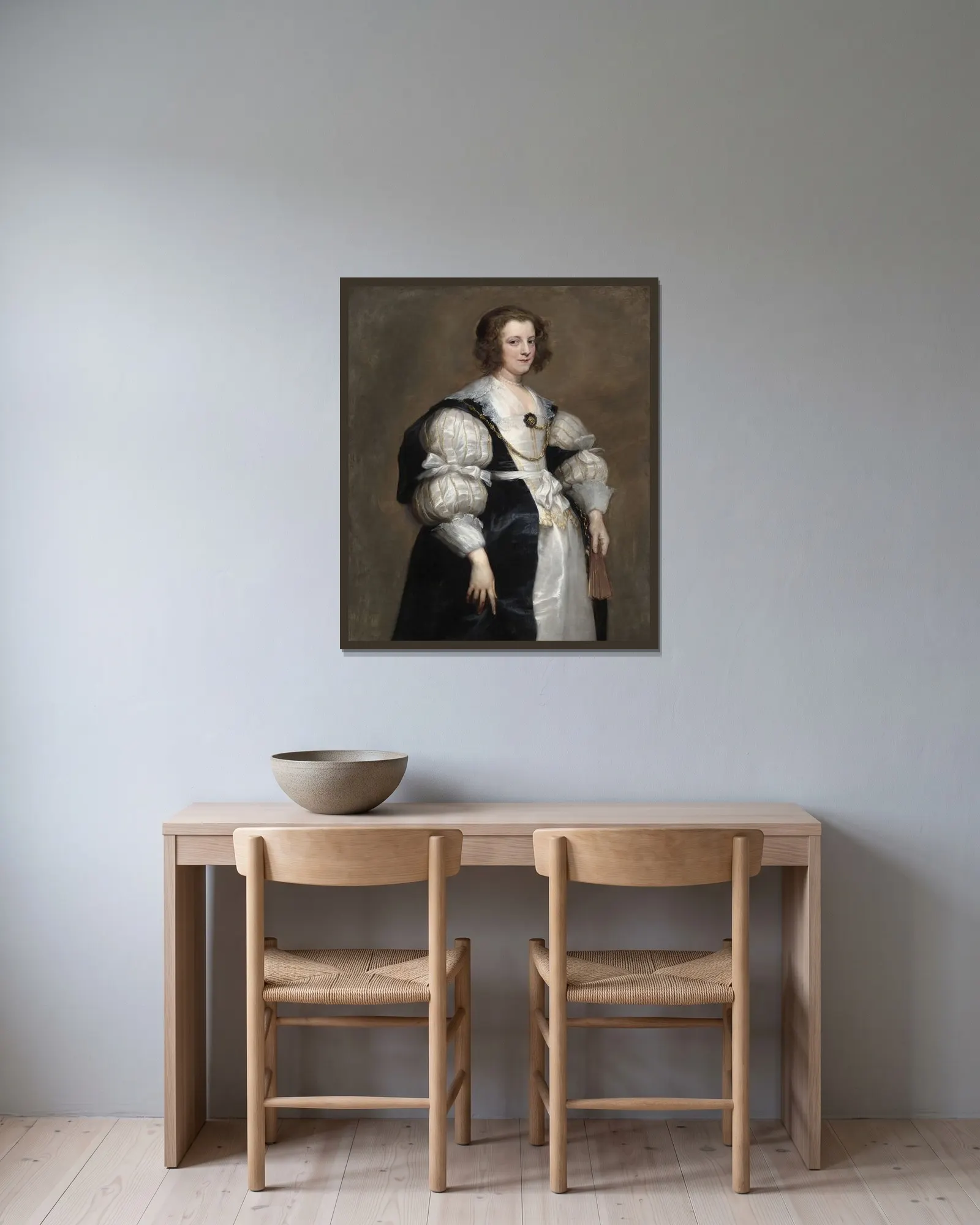 Lady with a Fan av Anthony van Dyck inramad på en vägg