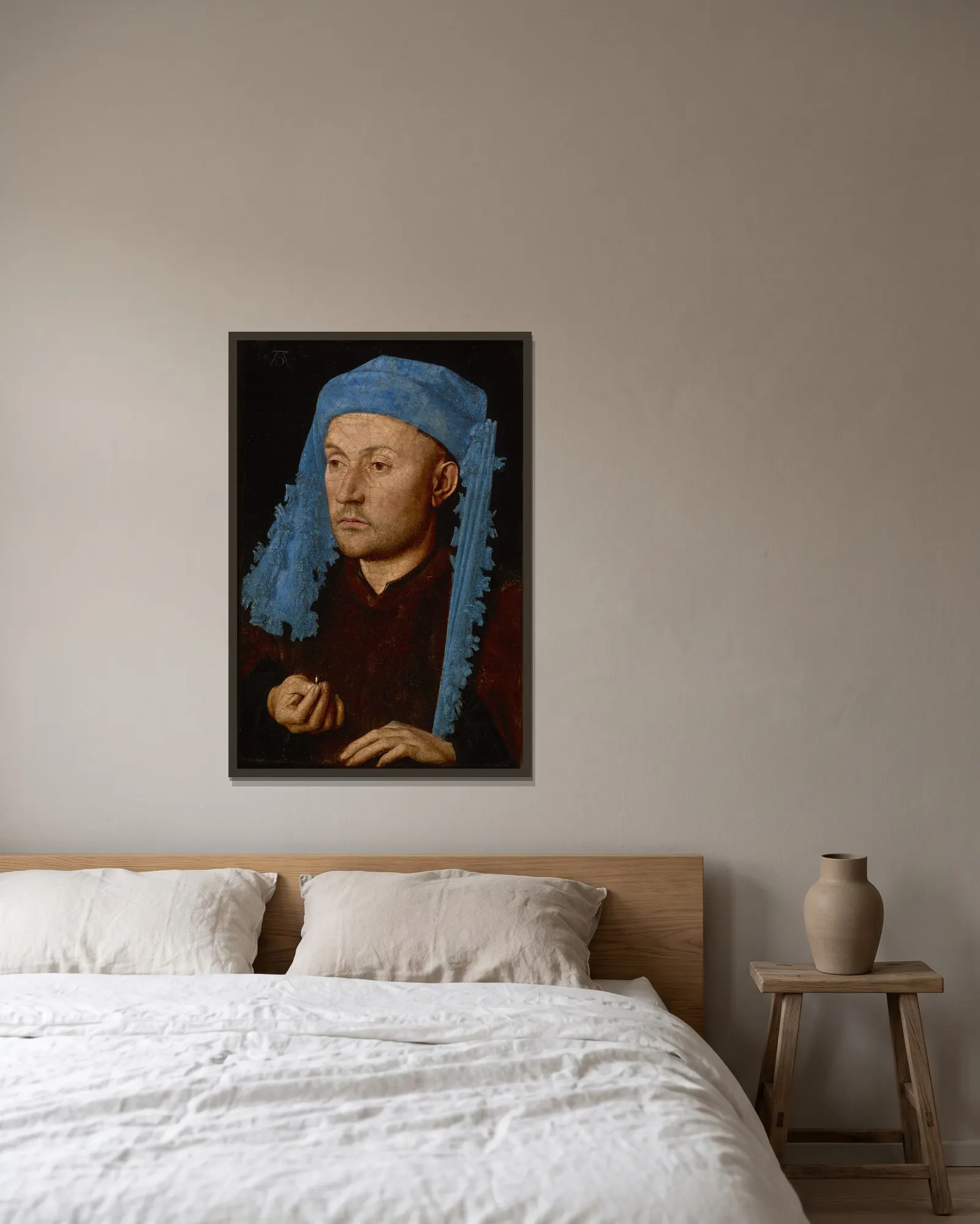 Man in a Blue Cap av Jan van Eyck inramad på en vägg