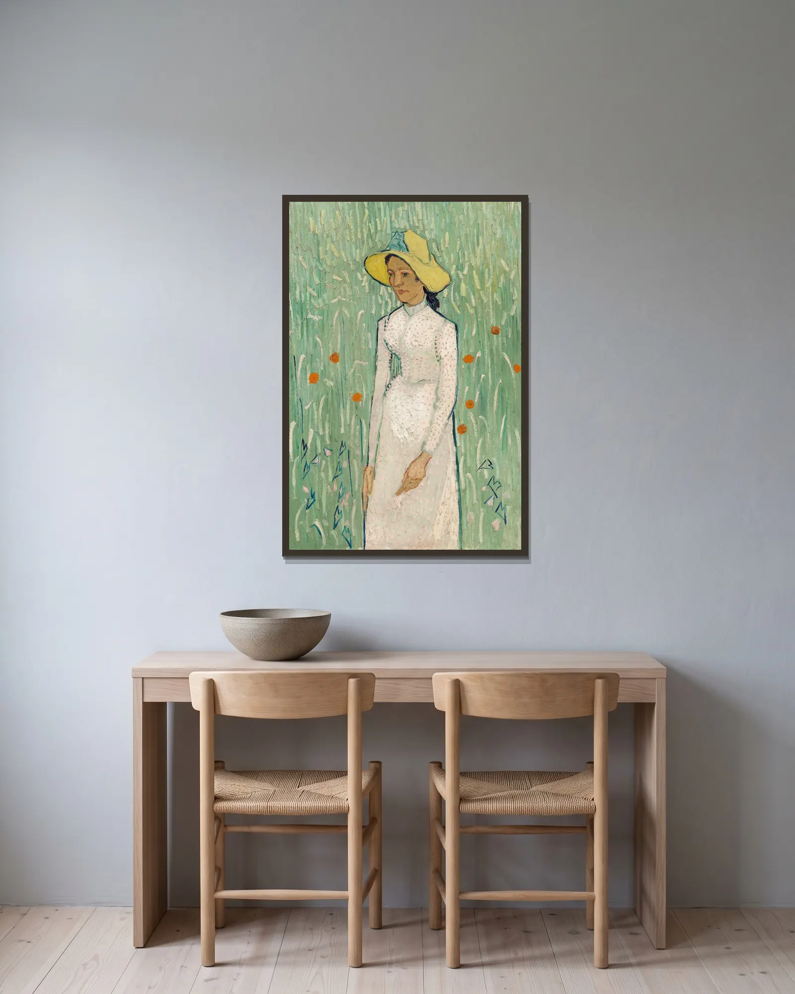 Girl in White av Vincent van Gogh inramad på en vägg