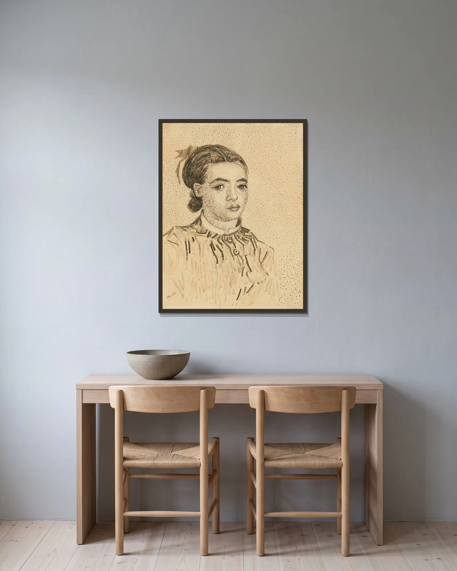 La Mousmé av Vincent van Gogh inramad på en vägg