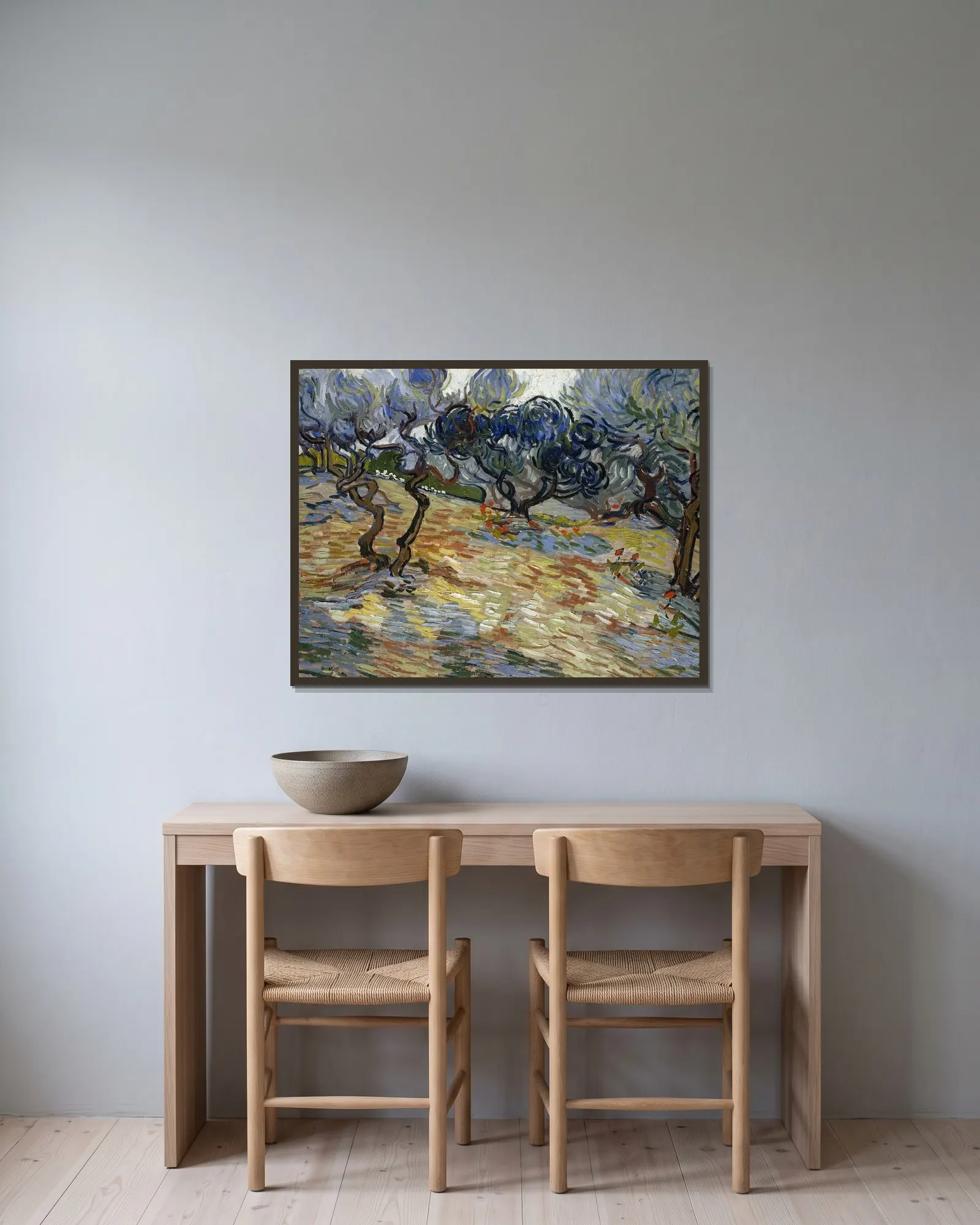 Olive Trees av Vincent van Gogh inramad på en vägg