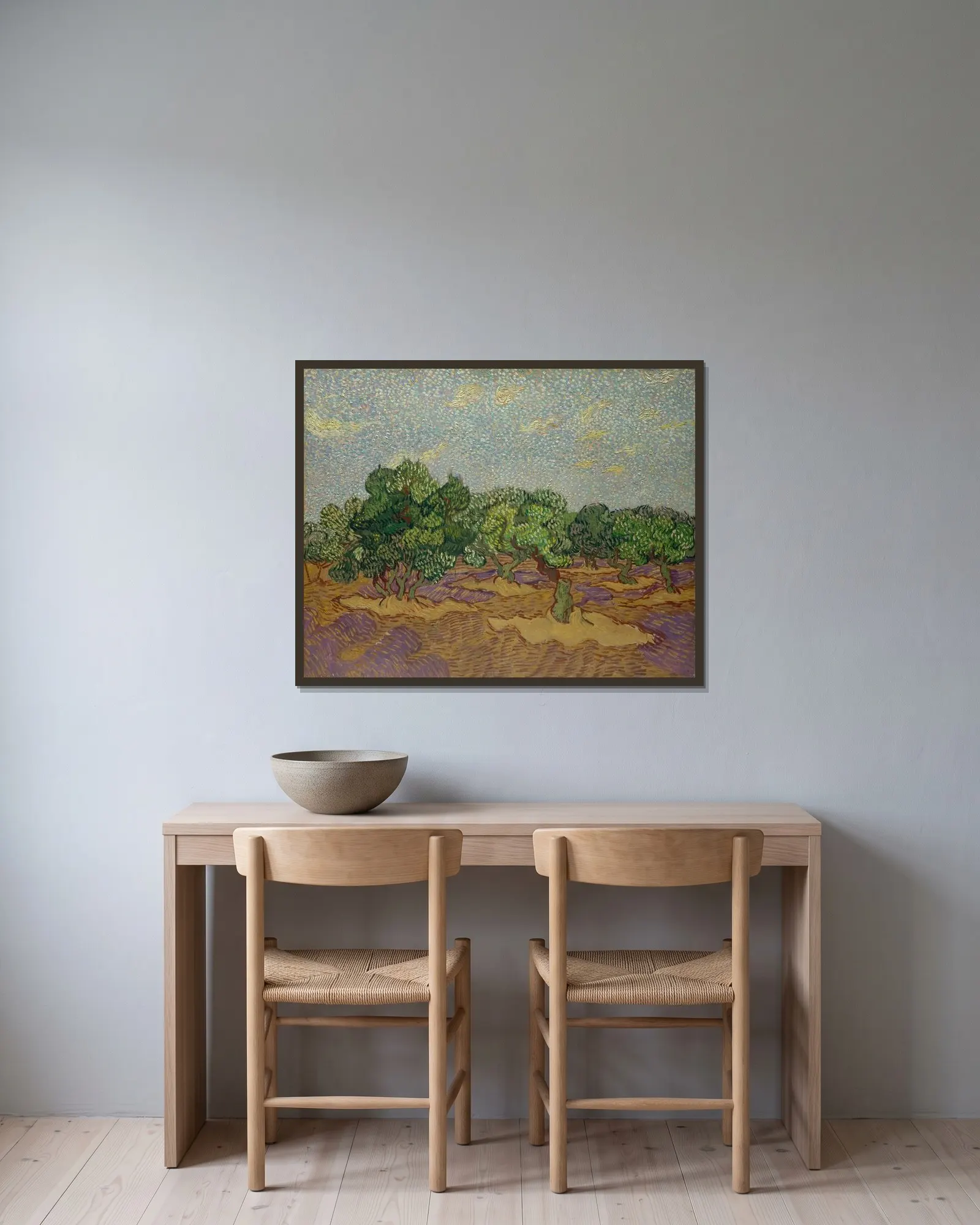 Olive Trees av Vincent van Gogh inramad på en vägg