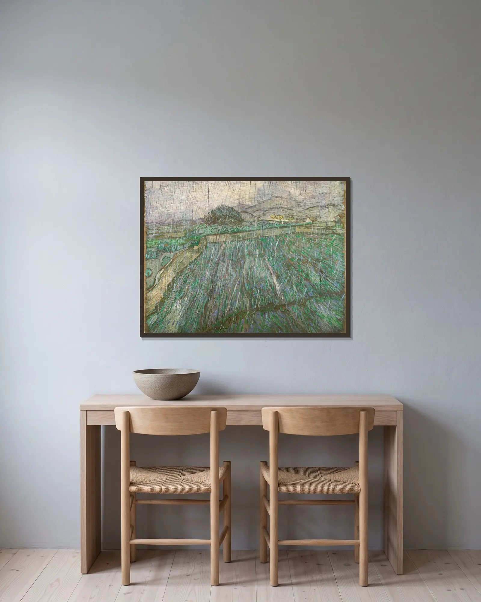 Rain av Vincent van Gogh inramad på en vägg