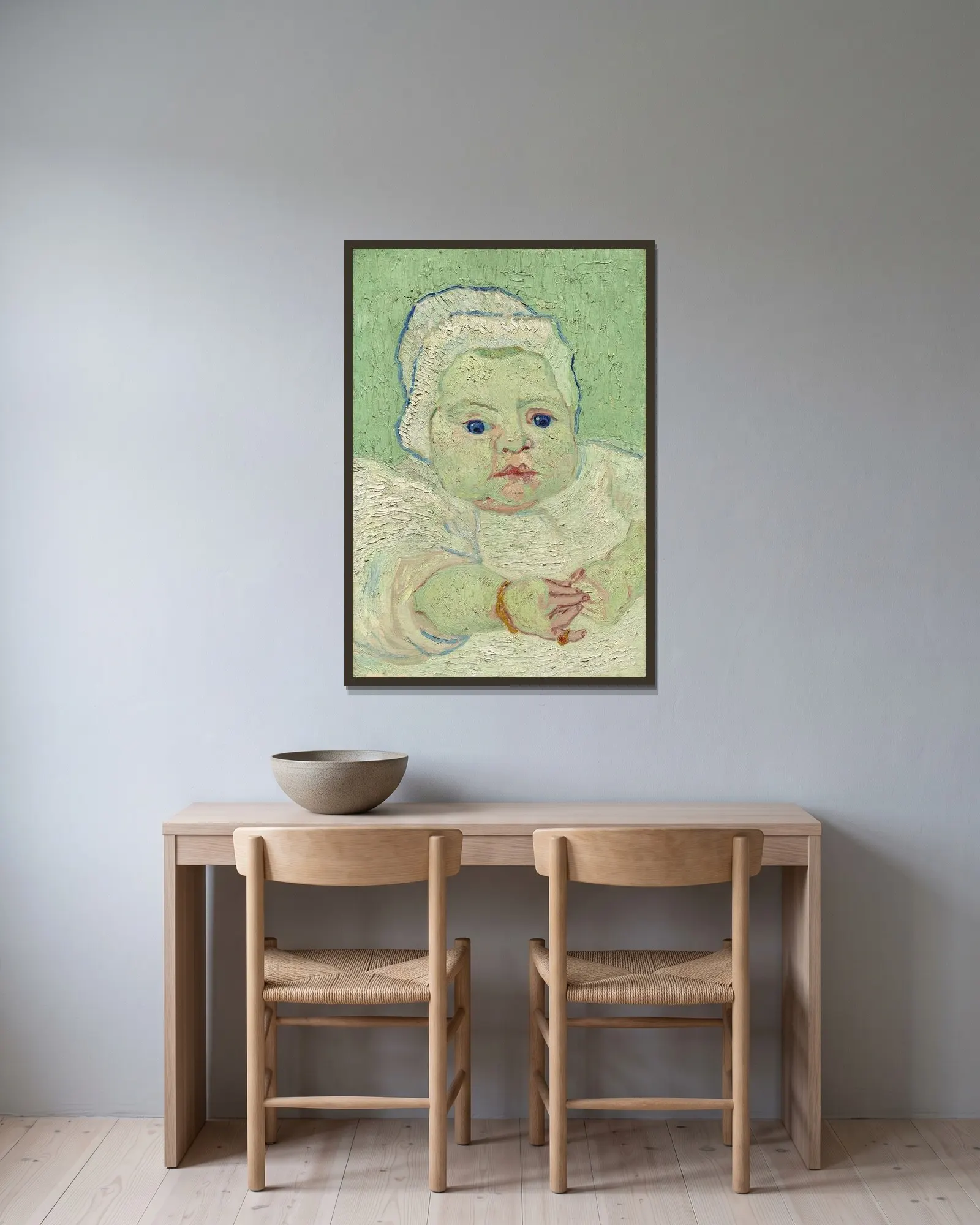 Roulin’s Baby av Vincent van Gogh inramad på en vägg