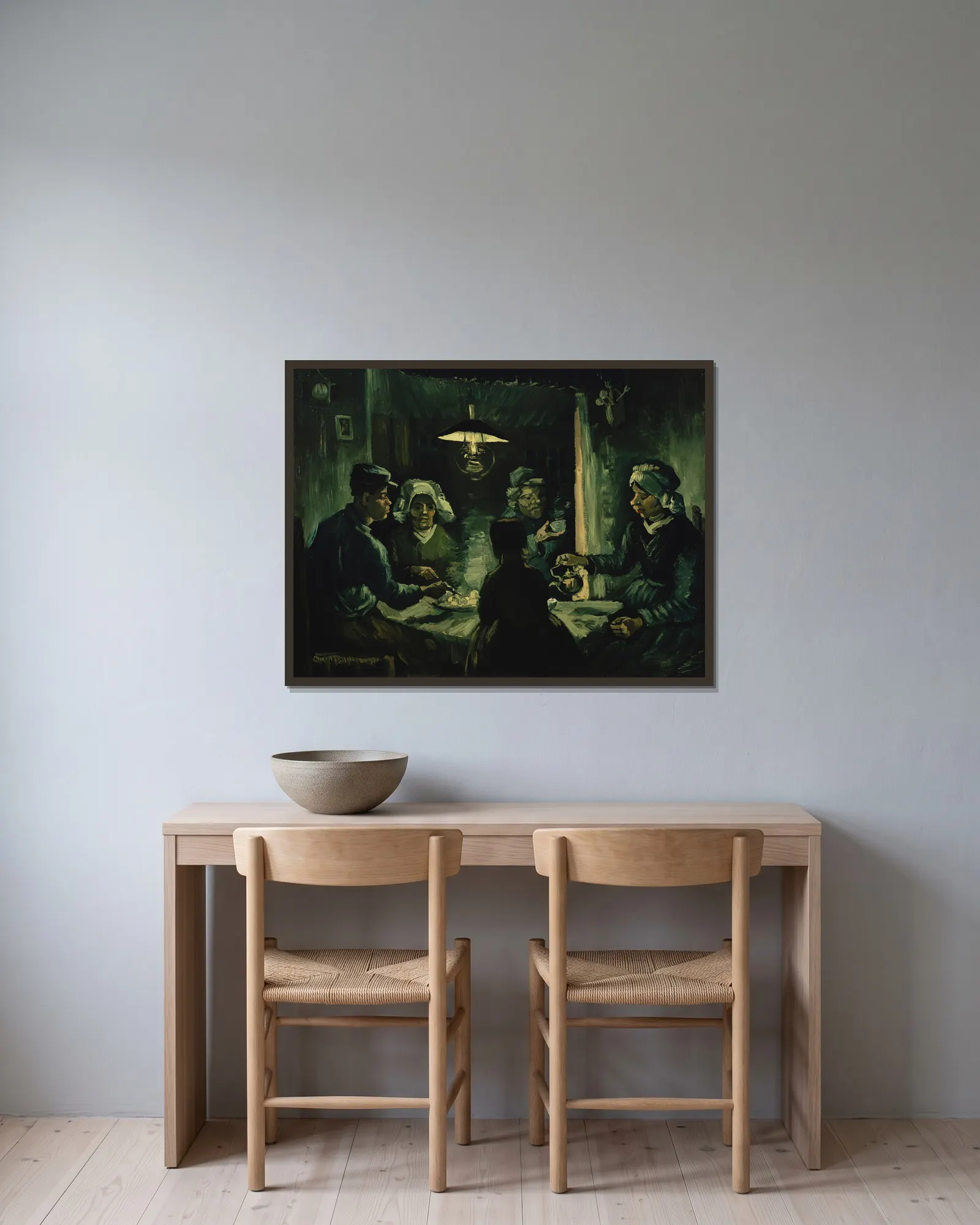 Potatisätarna av Vincent van Gogh inramad på en vägg