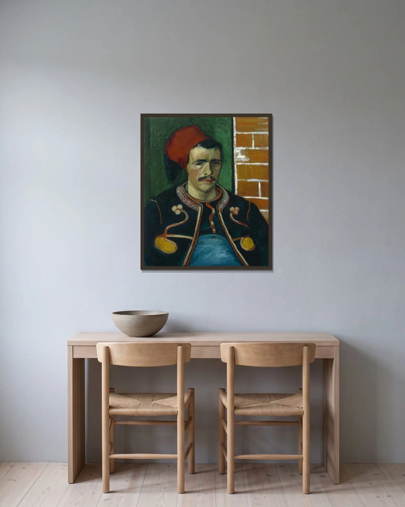 The Zouave av Vincent van Gogh inramad på en vägg