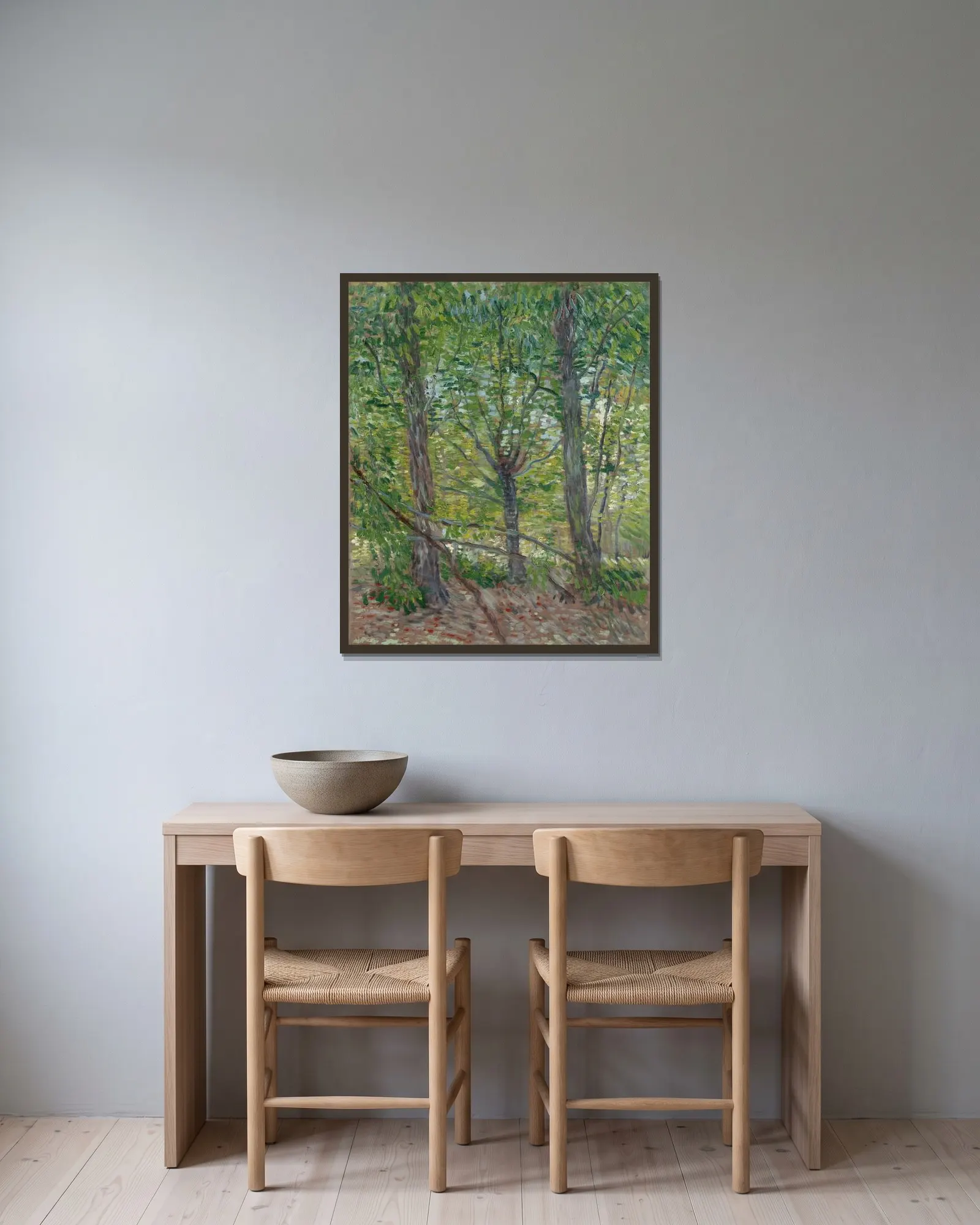 Trees av Vincent van Gogh inramad på en vägg