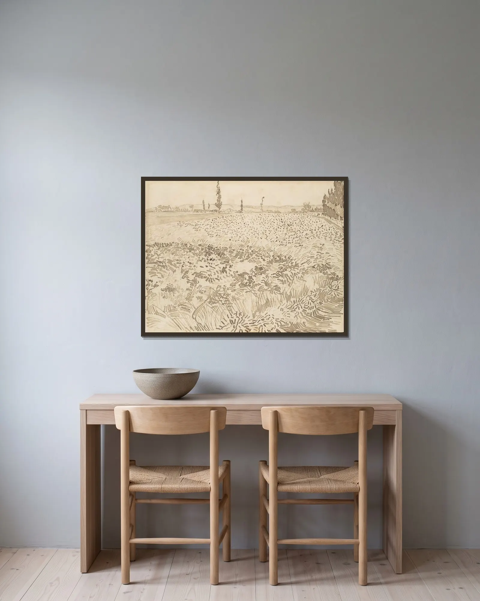 Wheat Field av Vincent van Gogh inramad på en vägg