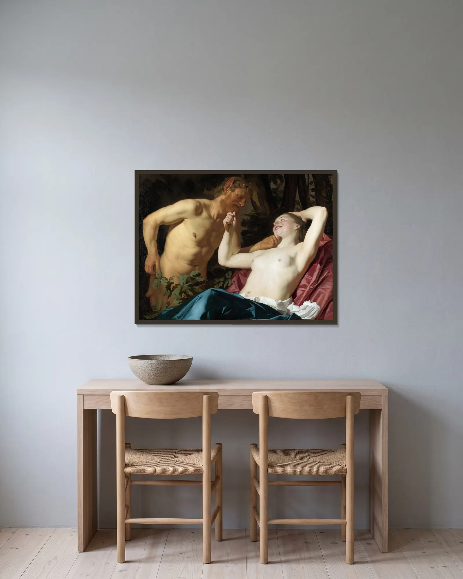 Satyr and Nymph av Gerard van Honthorst inramad på en vägg