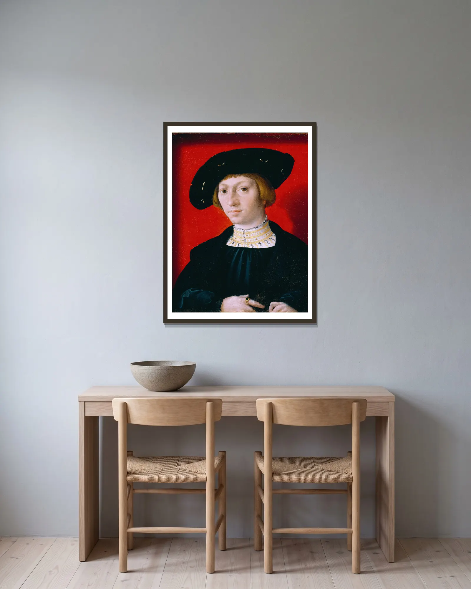 A Young Man av Bernard van Orley inramad på en vägg