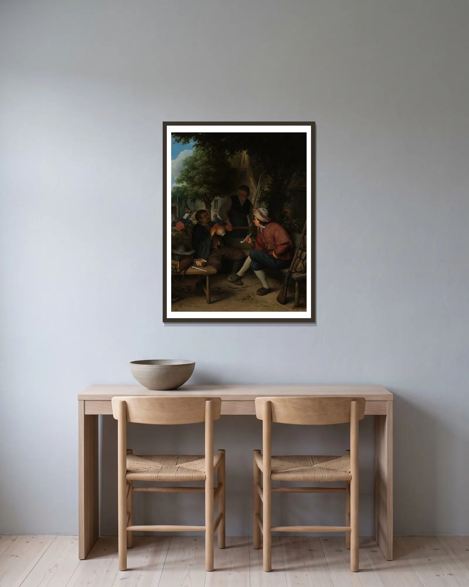 Travellers at Rest av Adriaen van Ostade inramad på en vägg